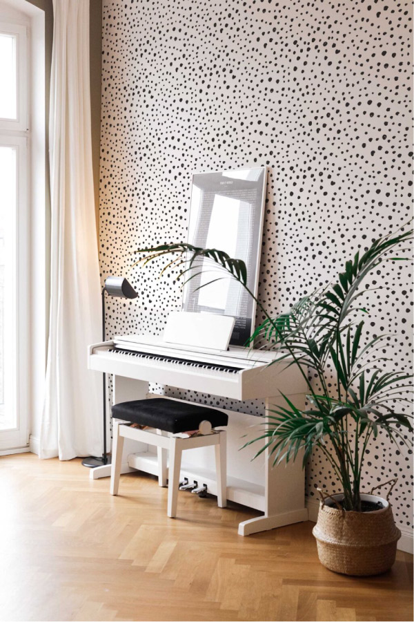 Black and white polka dot wallpaper in living room