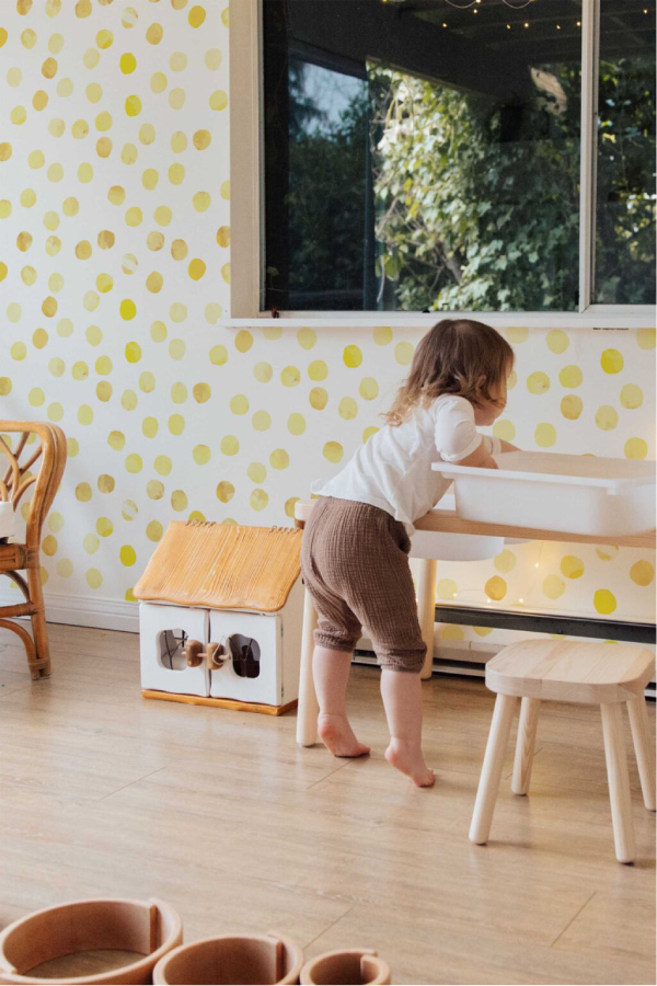 Yellow polka dot wallpaper in living room 