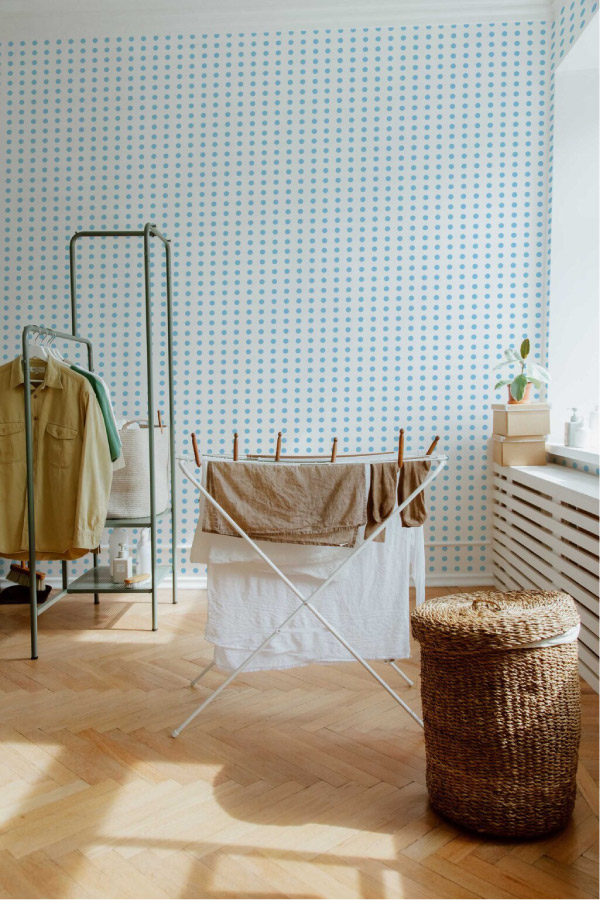 Light blue polka dot wallpaper in laundry room 