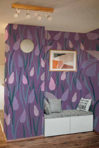 Purple Lavender Blooms covers two adjoining walls with a mural wallpaper of tall lavender sprigs on a deep purple background.