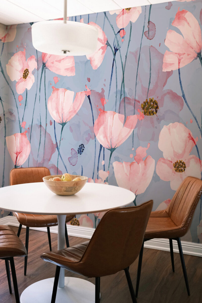 Airy Pink Poppy Blossoms removable wall mural covering a dining nook wall with watercolor pink poppies on a soft blue background.