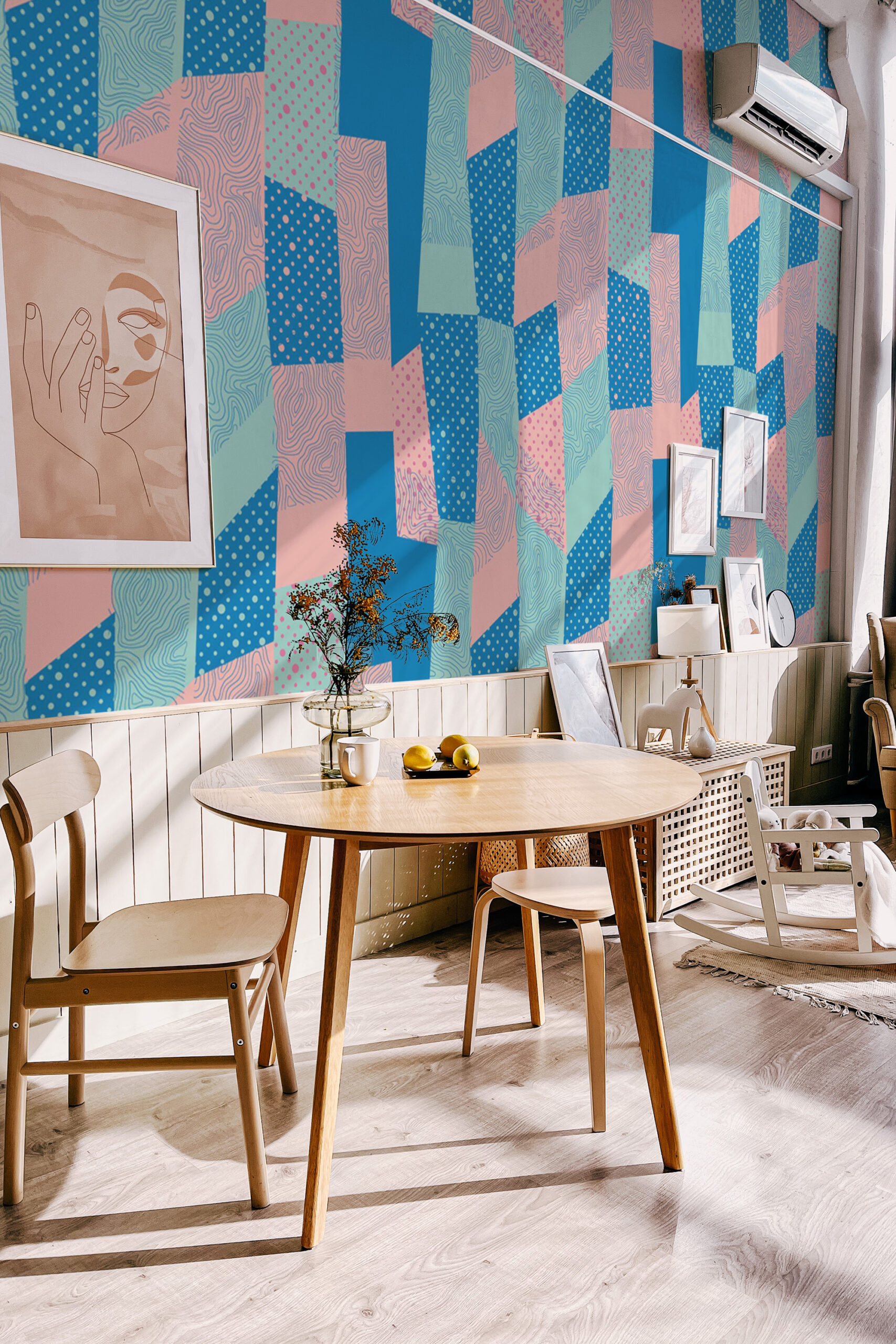 Retro Blue Geometric Patchwork covers a dining area accent wall as a wall mural with bold blue, teal, and pink shapes.