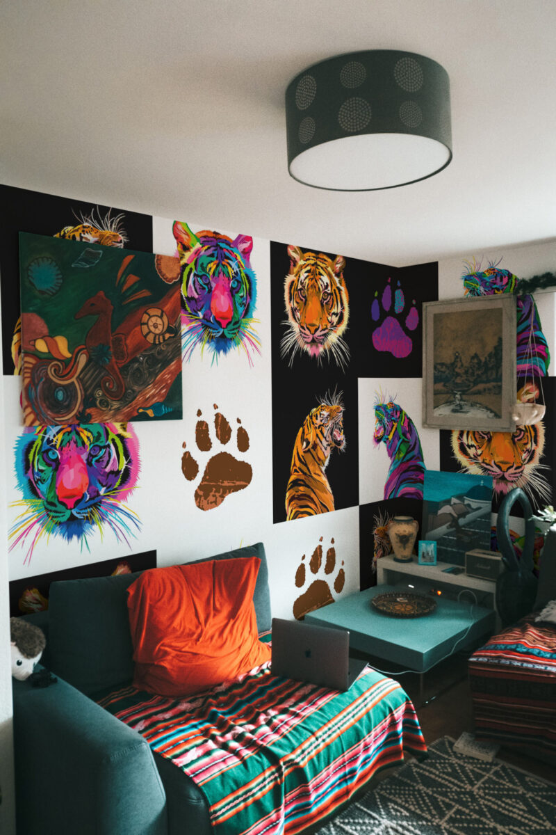 Colorful Pop Art Tigers shows a wallpaper mural arranged as a bold patchwork of neon tiger faces and paw prints on a bedroom wall.