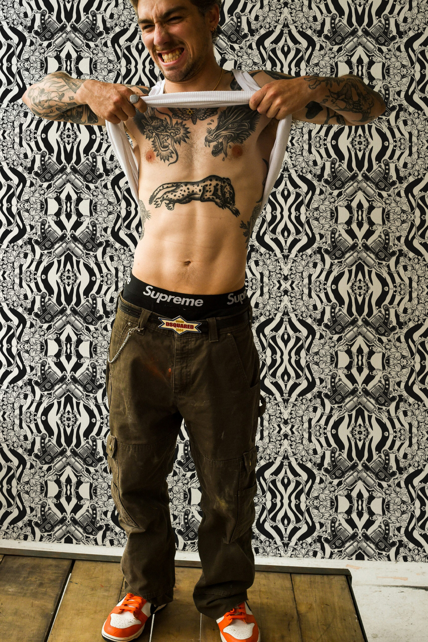 Vintage Black Tattoo Machine peel and stick wallpaper with black-and-cream tattoo machines, zebra stripes, and floral damask pattern.