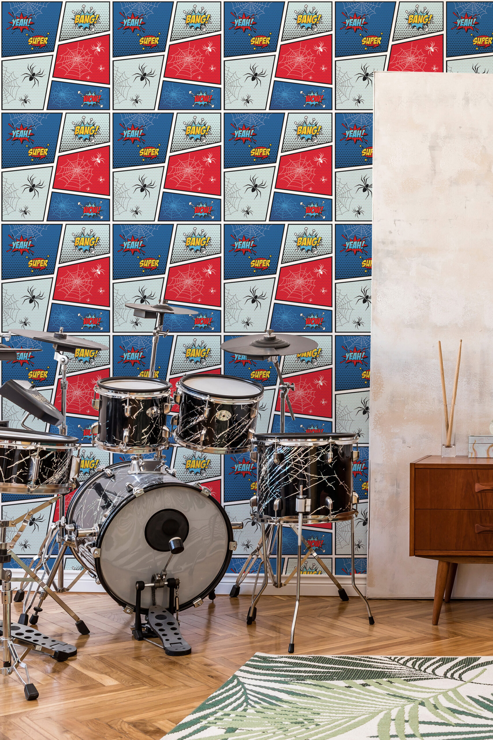 Bold Blue Comic Words self-adhesive wallpaper in a music room, with comic panels and speech words behind a drum kit.