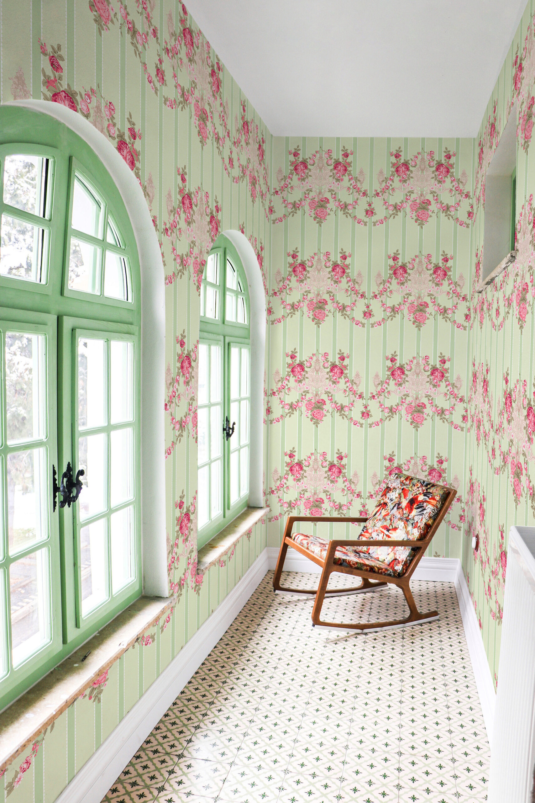 Vintage Floral Stripe peel and stick wallpaper with pink rose garlands on green stripes covering a bright hallway.