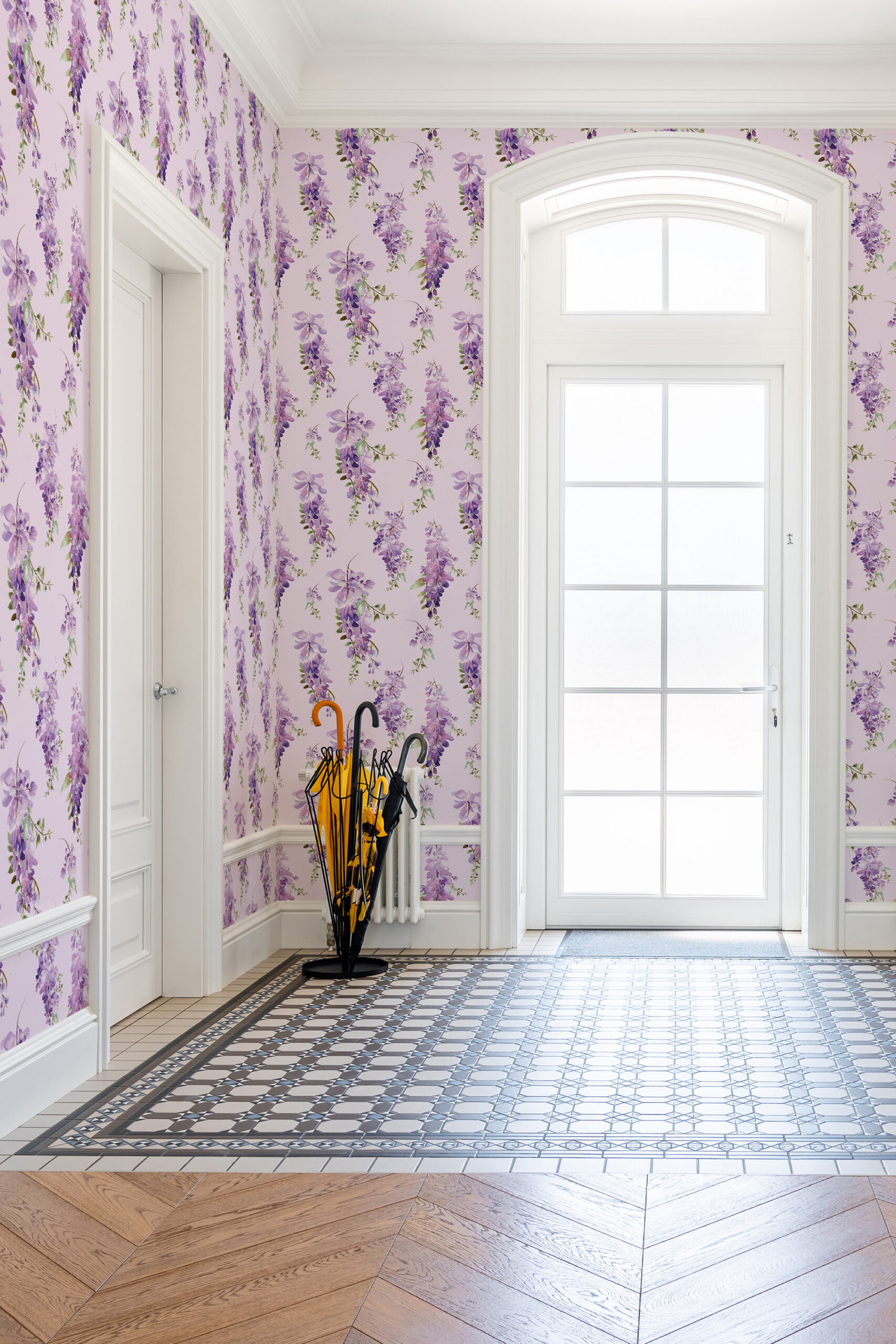 Delicate Purple Wisteria non-pasted wallpaper with cascading floral blooms on pale lilac walls in a bright entryway.