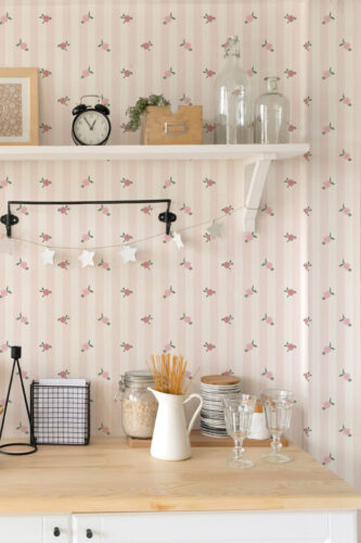 Vintage Pink Rose Stripe peel and stick wallpaper with pale pink stripes and scattered rosebuds behind open kitchen shelves.