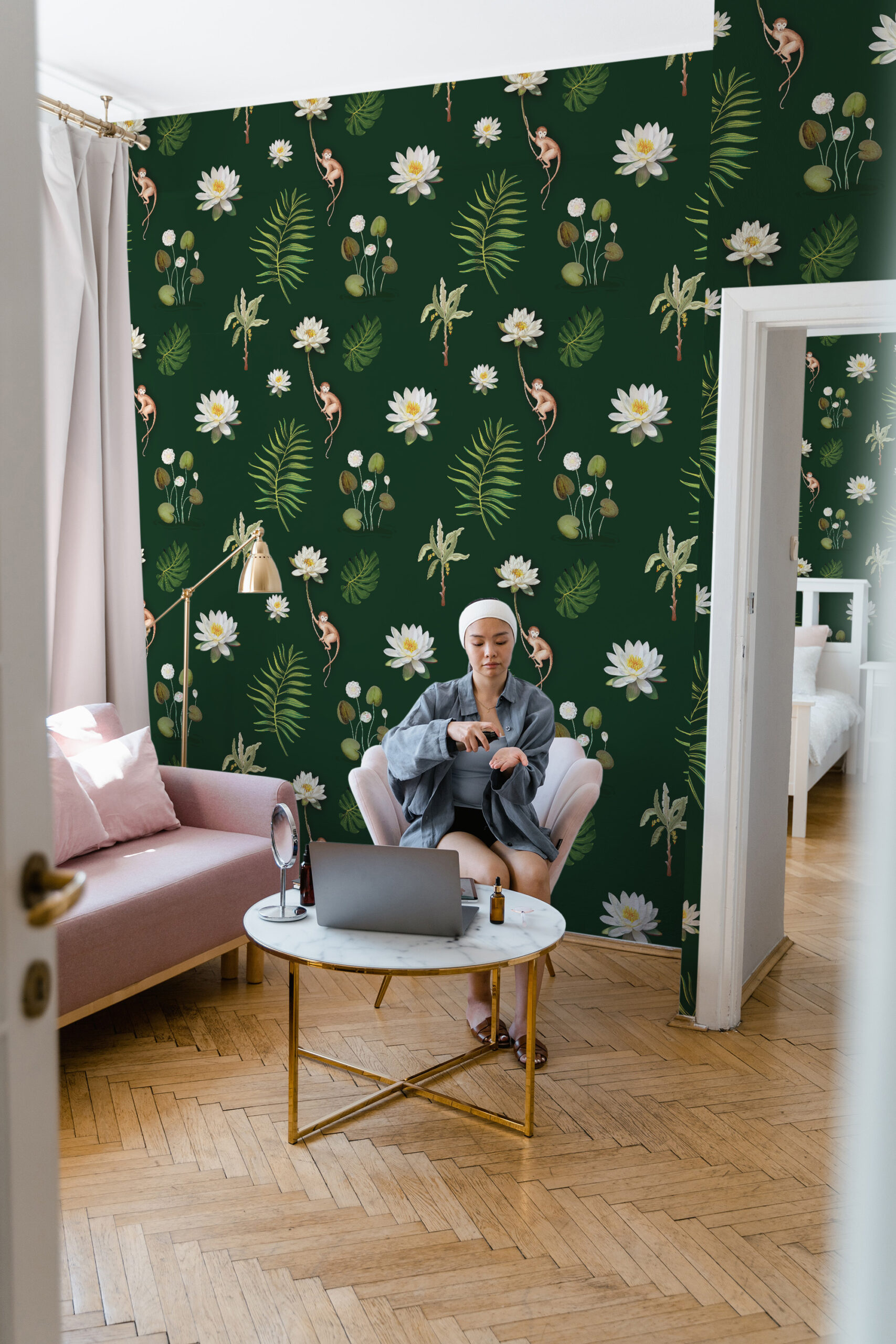 Monkey and White Lotus self-adhesive wallpaper with white lotus flowers, tropical leaves, and small monkeys on a deep green background.
