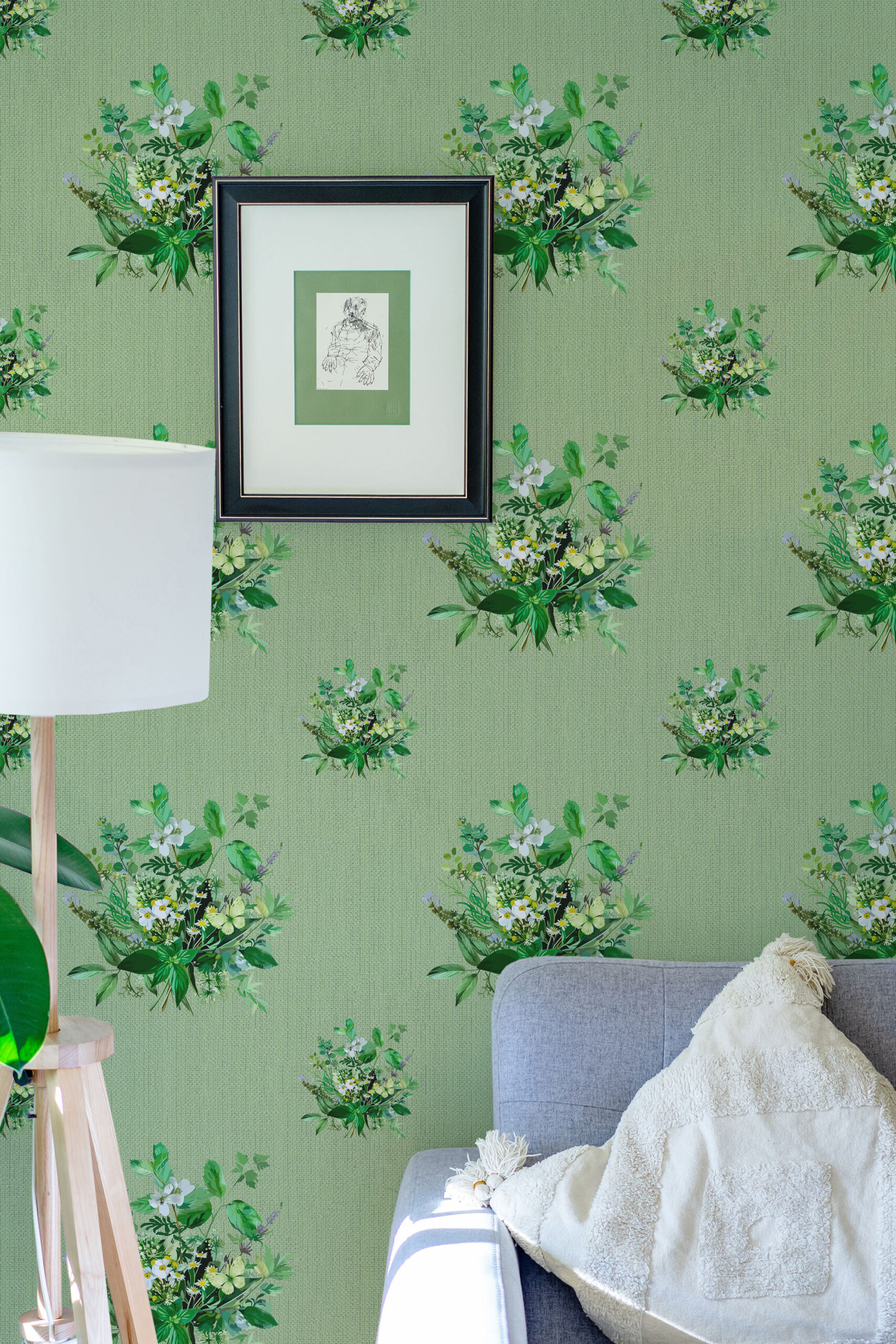 Grasscloth Look Floral peel and stick wallpaper with scattered green leaf bouquets and white blossoms behind a framed print.