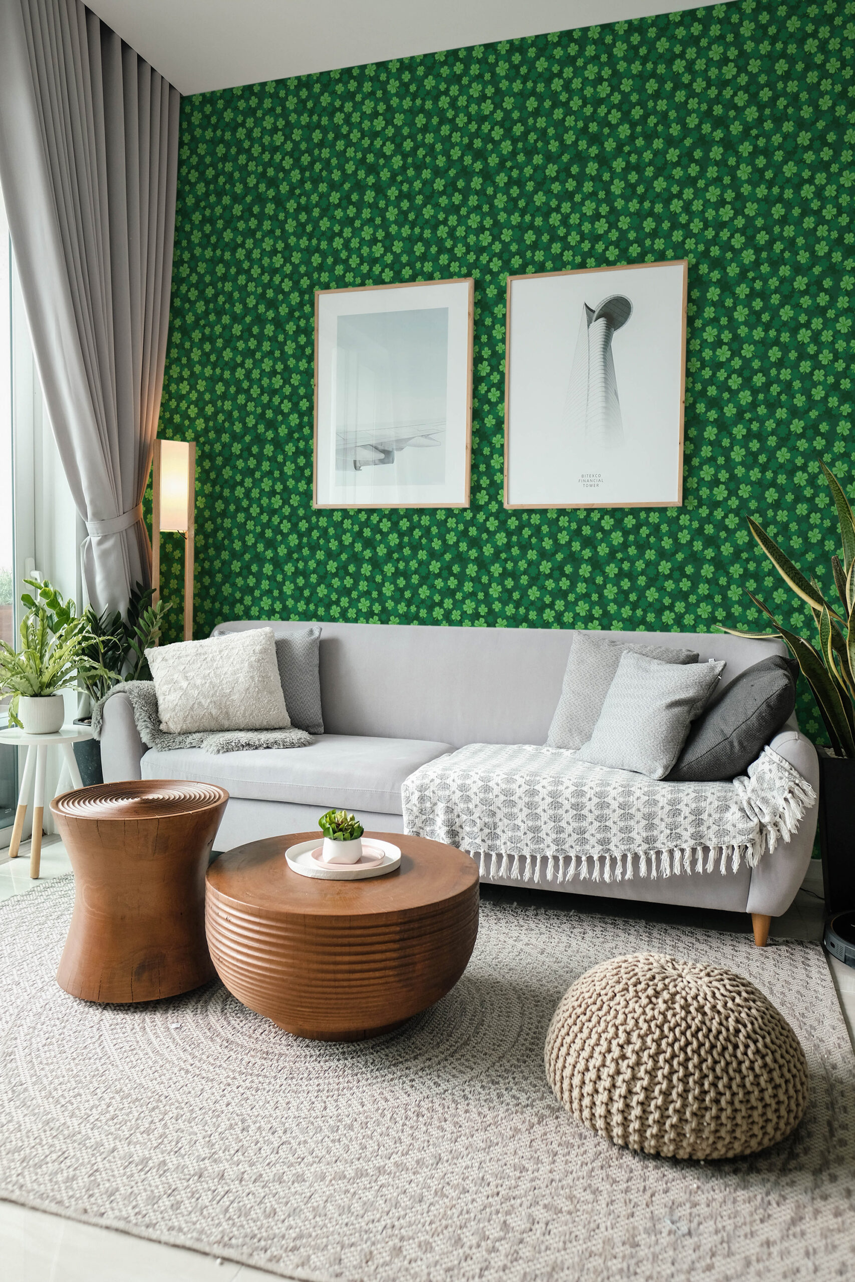 Four Leaf Clover pre-pasted wallpaper with a small clover pattern covering an accent wall behind a gray sofa.