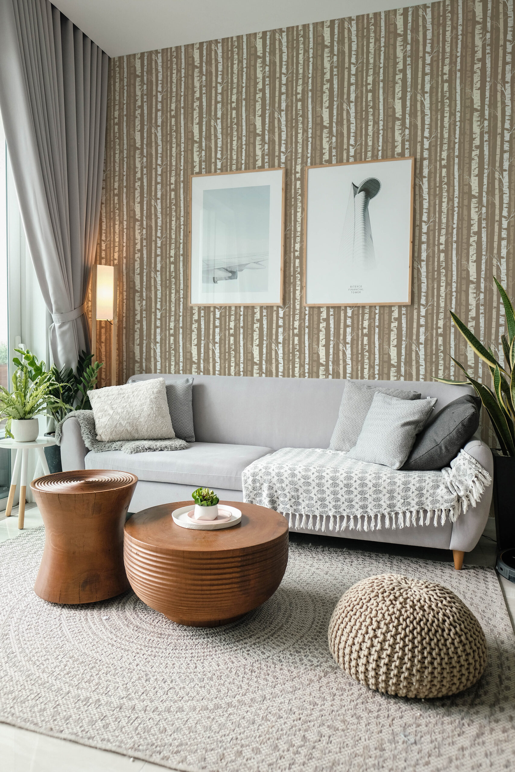 Dense Beige Birch Tree pre-pasted wallpaper with vertical birch trunks covers the living room wall behind a gray sofa.