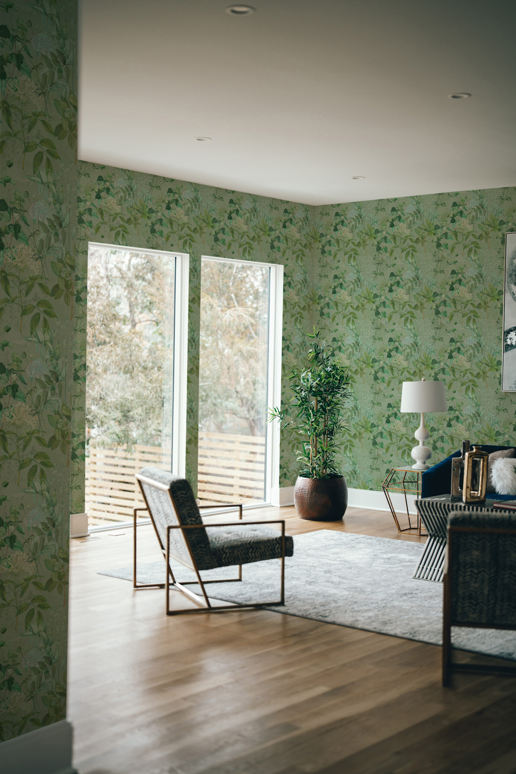 Dreamy Sage Botanical pre-pasted wallpaper with soft green leafy florals across a living room accent wall.