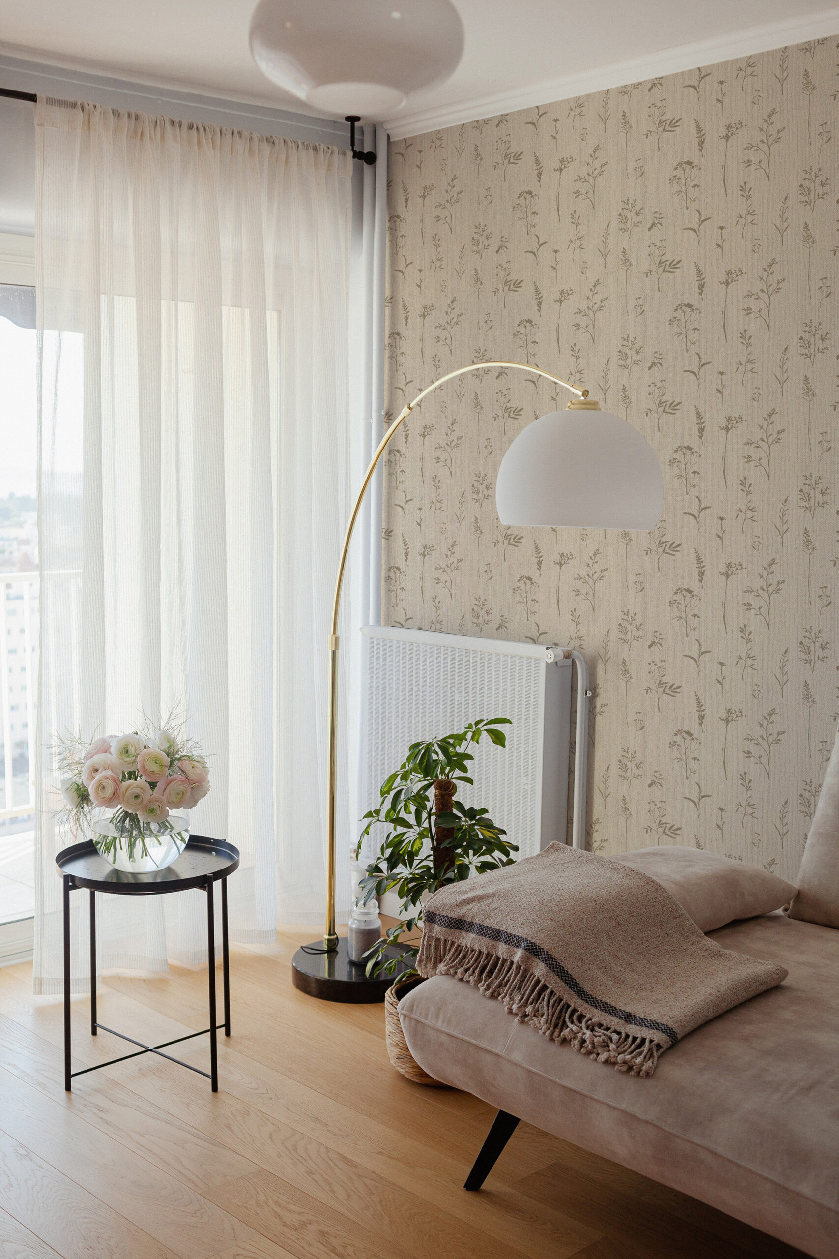 Grasscloth Look Wildflower non-pasted wallpaper on a bedroom accent wall beside a window with sheer curtains.