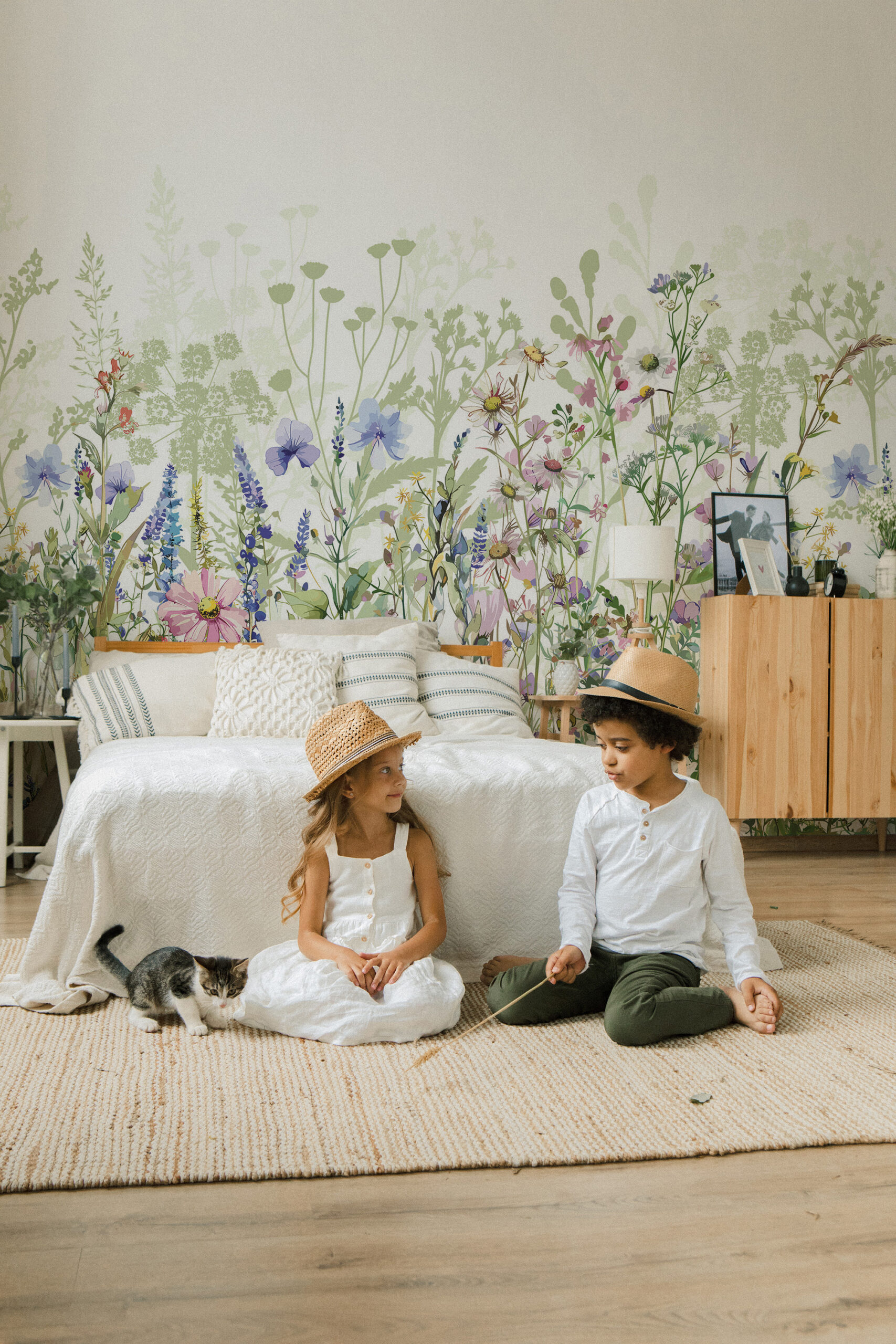Fresh Garden Wildflowers pre-pasted wall mural spans the bedroom wall with soft watercolor blooms, and meadow stems behind the bed.
