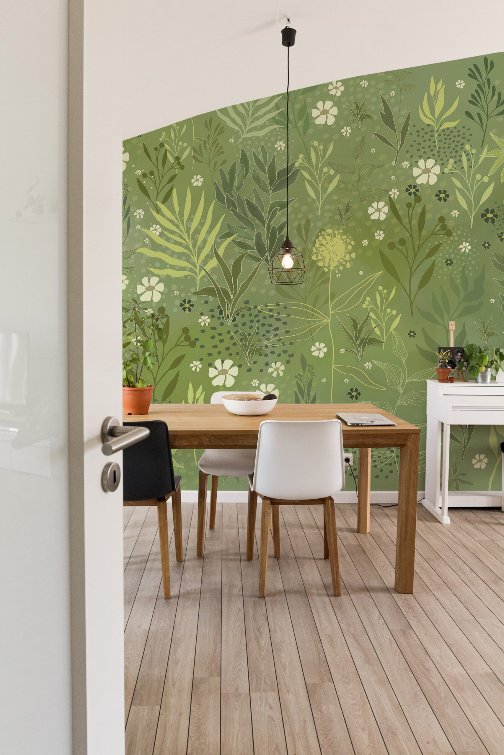 Whimsical Wild Garden self-adhesive Wall Mural on a dining room accent wall with green leaves and small white flowers