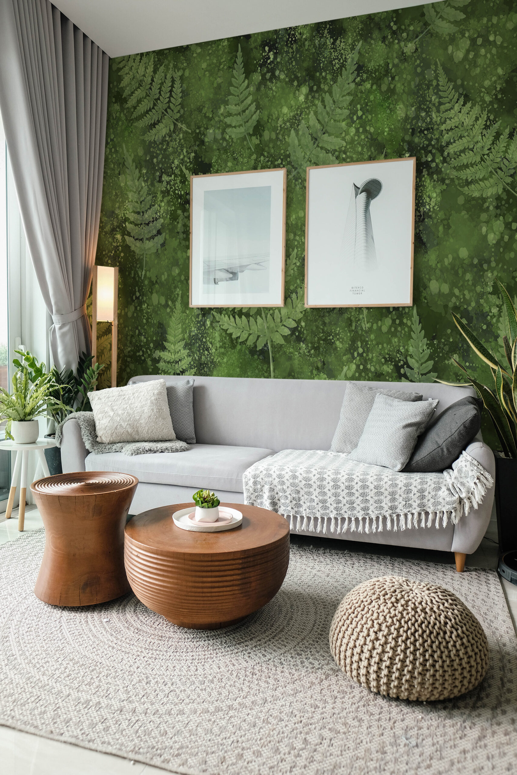Mossy Fern Leaves pre-pasted wall mural covering the living room accent wall behind a gray sofa, with layered fern silhouettes on green.