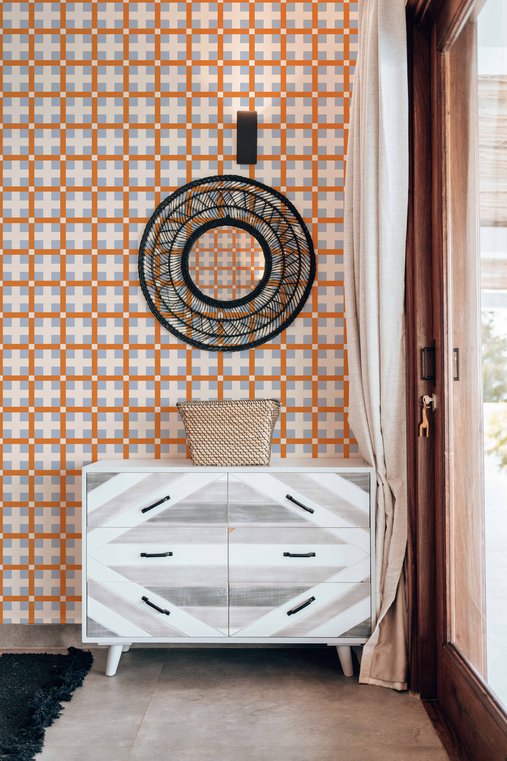 Orange Retro Cross Grid non-pasted wallpaper with orange and gray crosshatch checks, shown as an accent wall behind a dresser.