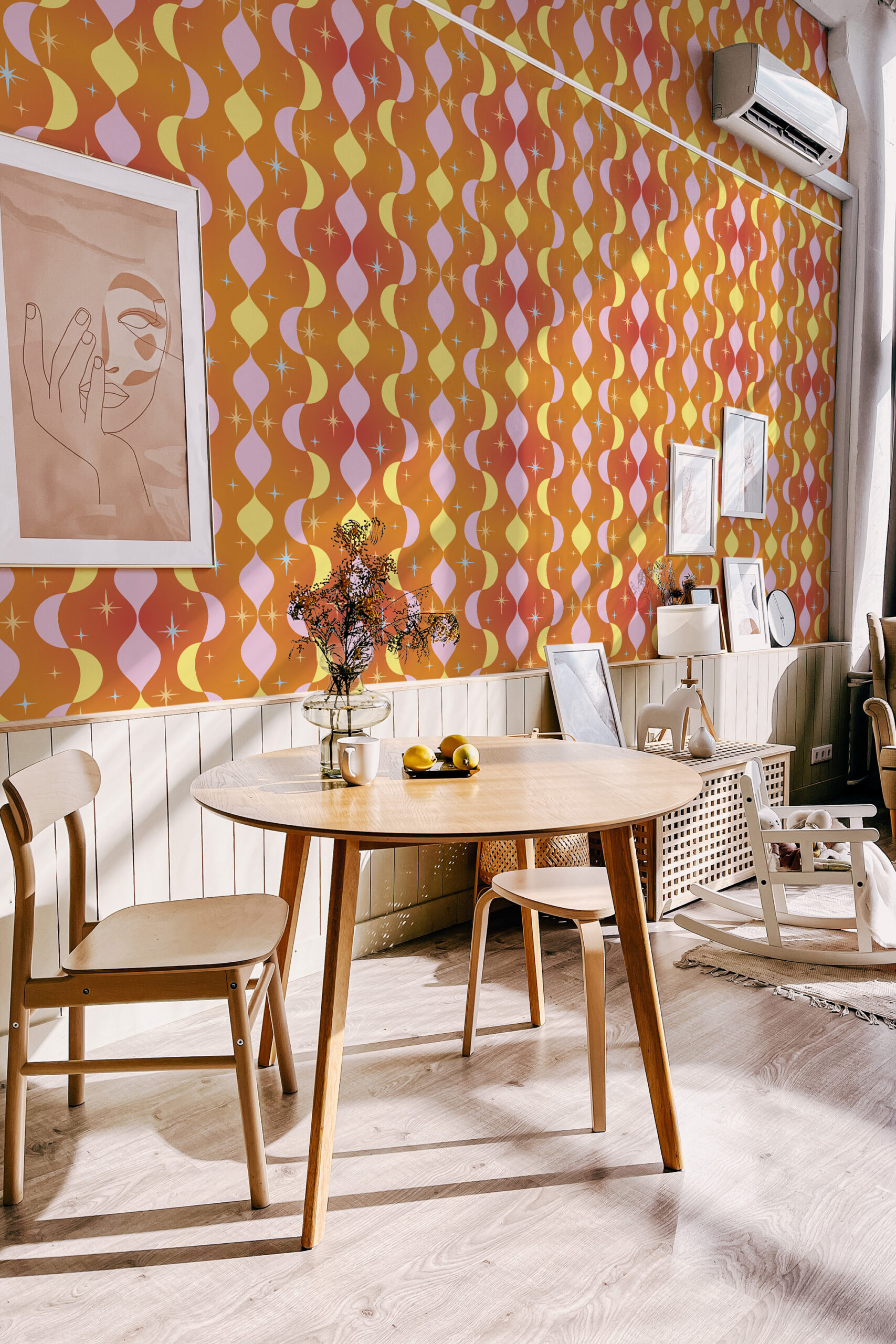 Retro Orange Stars non-pasted wallpaper on a dining room accent wall with wavy pastel stripes and small starbursts.