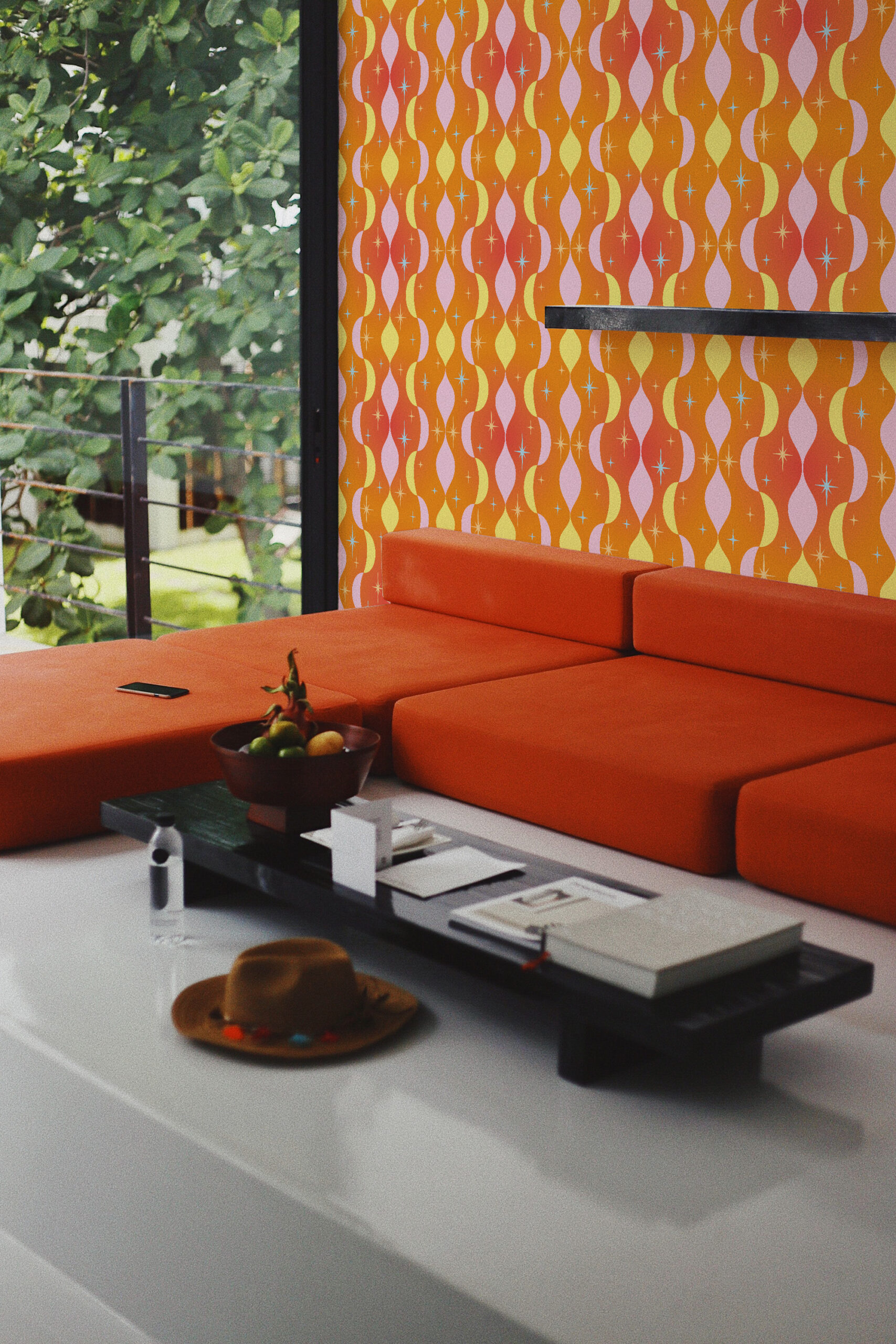 Retro Orange Stars self-adhesive wallpaper with wavy orange, yellow, and lilac stripes behind an orange sofa.