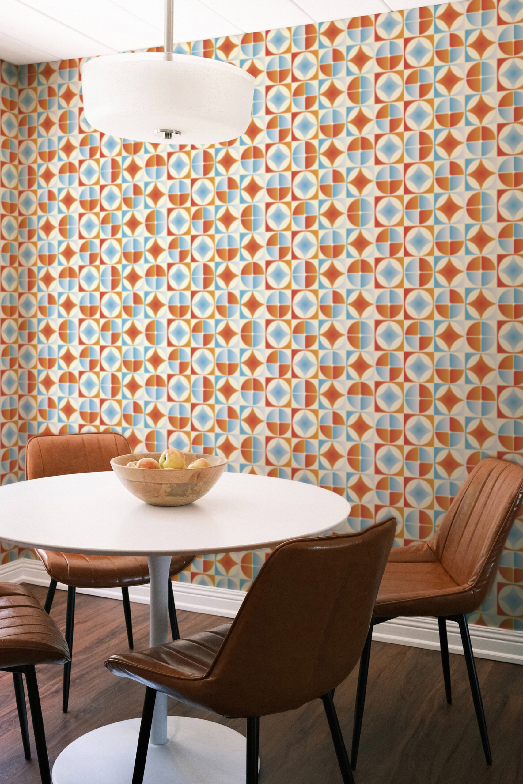 Retro Blue Orange Tile non-stick wallpaper with colorful geometric tiles covering the dining area wall behind a round table.