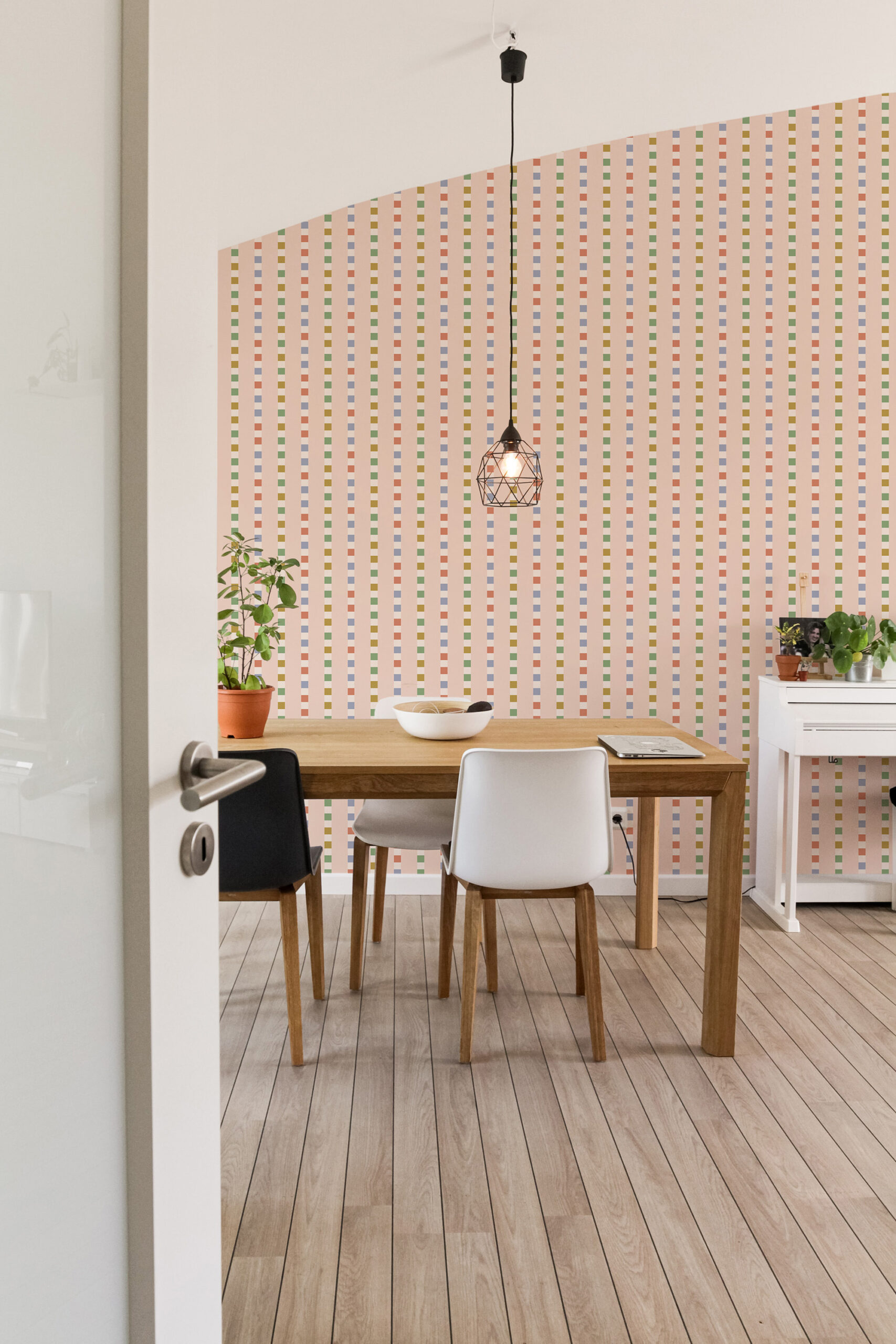 Retro Pink Striped Geometric pre-pasted wallpaper with multicolor vertical block stripes across the dining area wall.