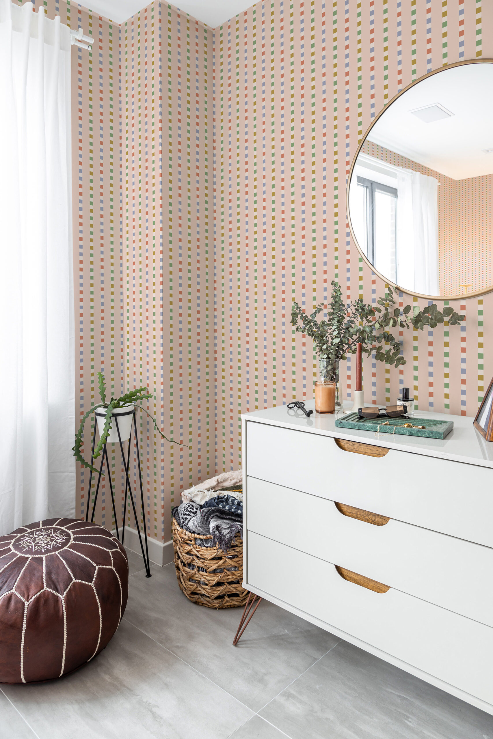 Retro Pink Striped Geometric non-pasted wallpaper with narrow vertical pastel stripes on an accent wall behind a dresser.