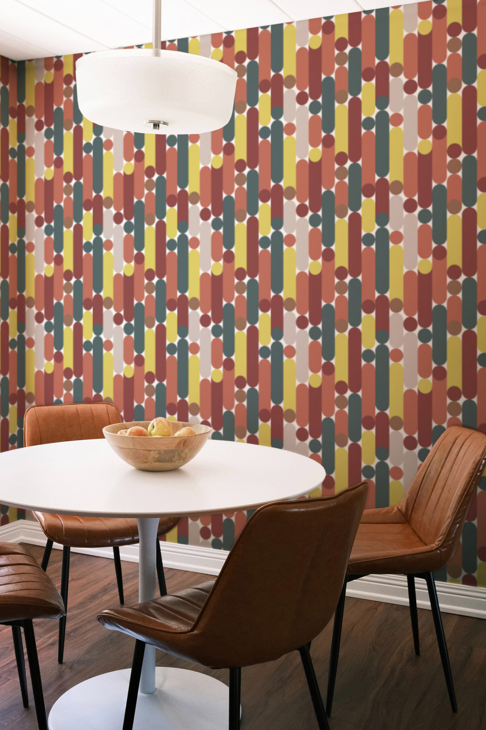 Retro White Capsule Geometric peel and stick wallpaper in a dining area, with vertical capsule shapes and dots in teal, mustard, and rust.