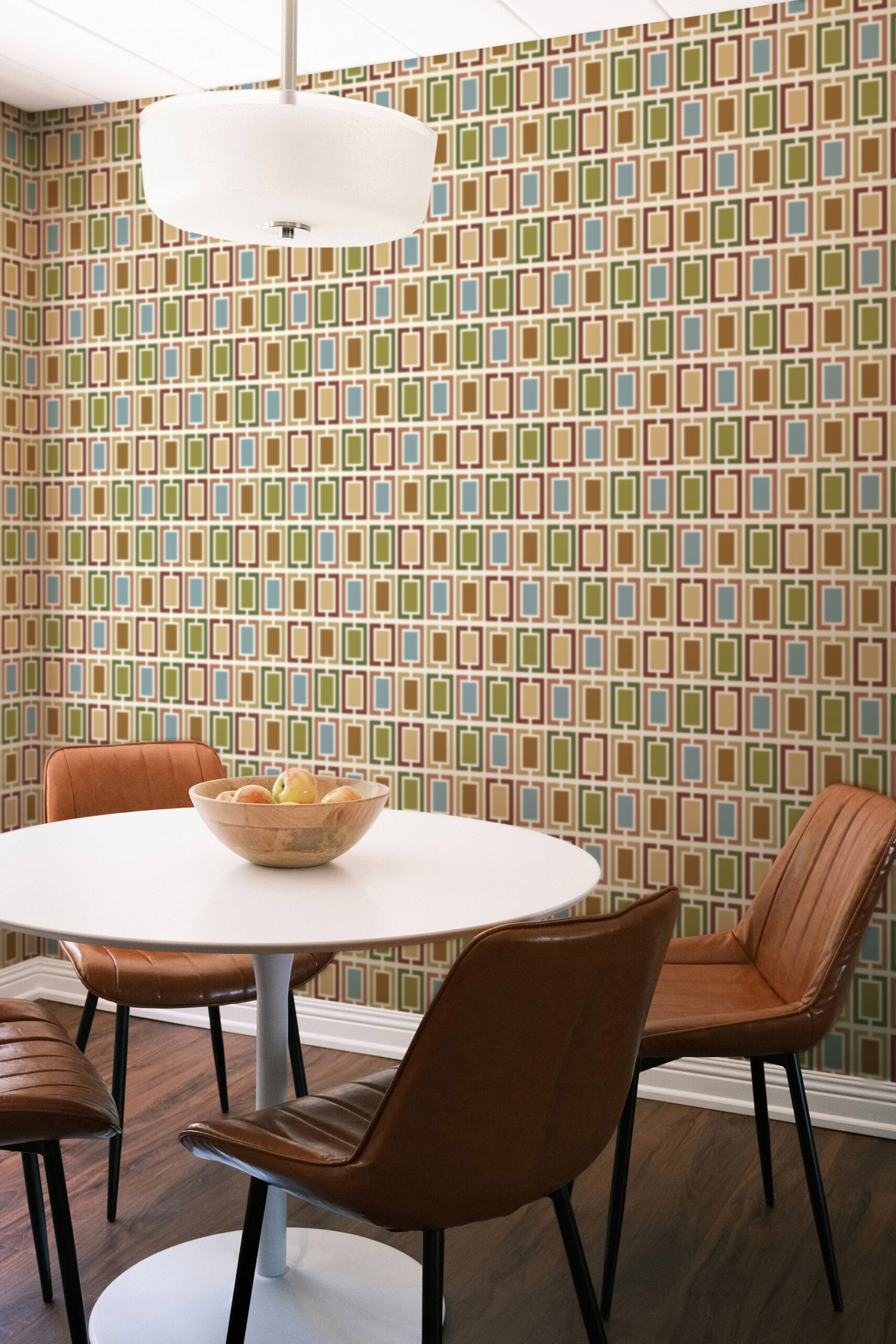 Retro White Geometric Frames traditional wallpaper with colorful rectangular frames covering a dining nook accent wall.