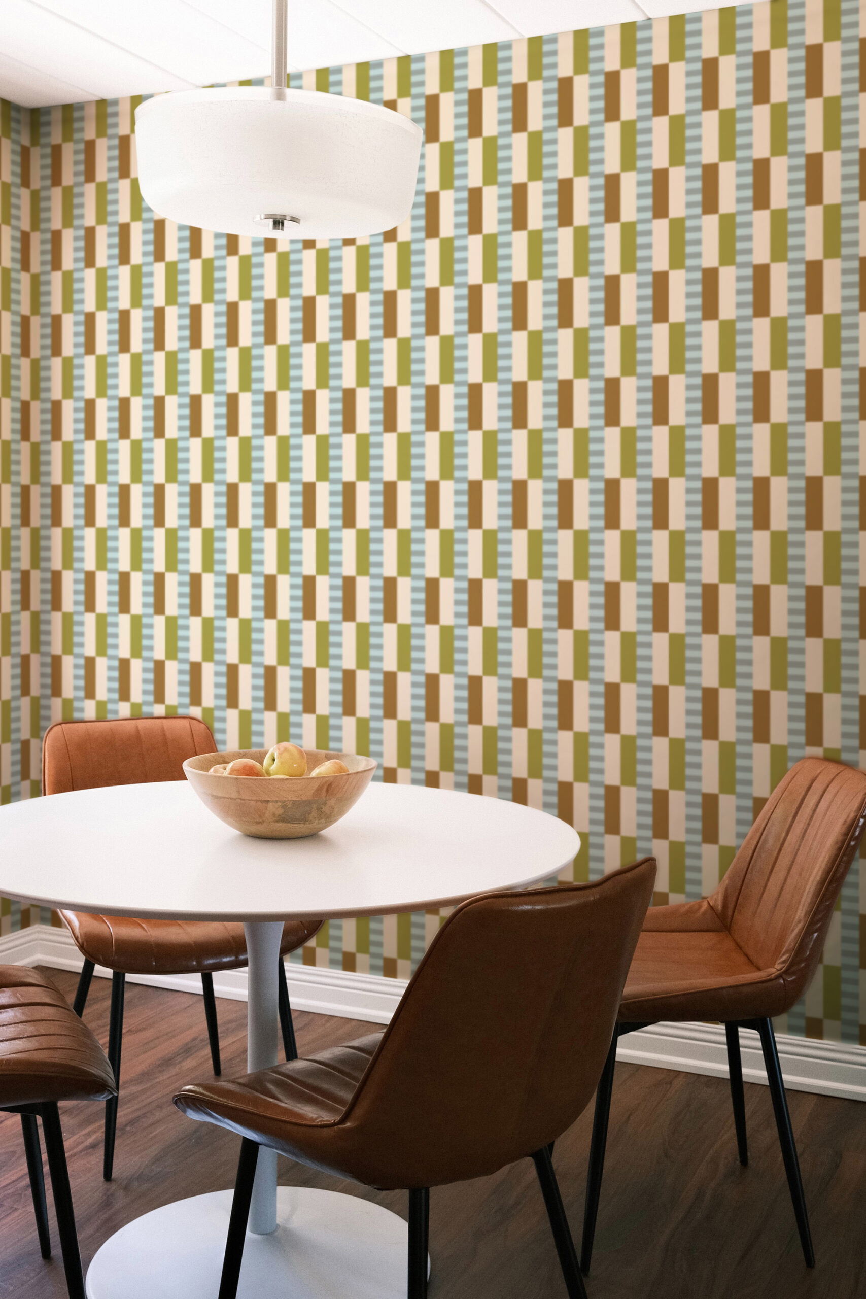 Retro Beige Geometric self-adhesive wallpaper with staggered blocks in beige, brown, olive, and blue behind a dining table.