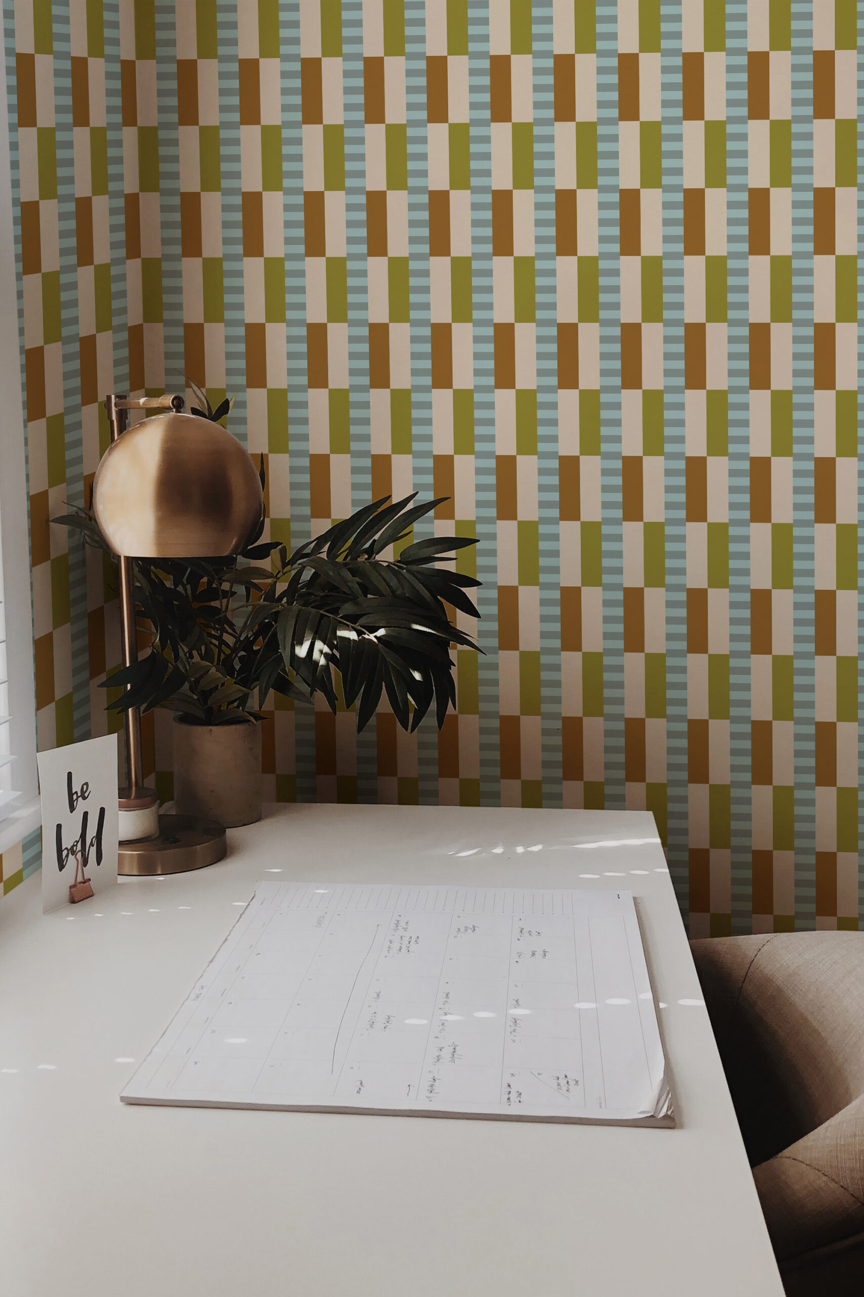 Retro Beige Geometric non-pasted wallpaper with vertical block checks in beige, olive, and brown behind a small desk.