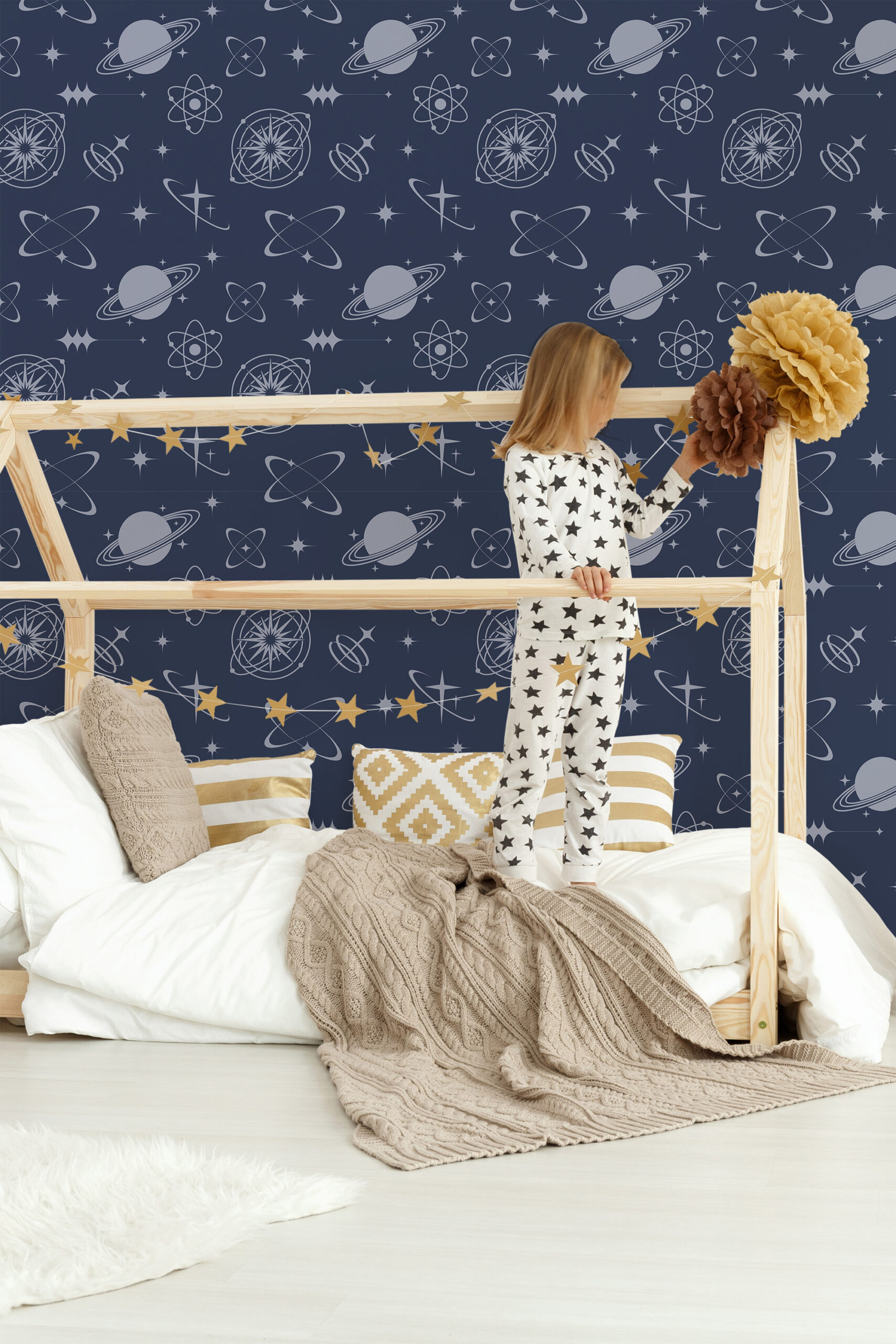 Retro Navy Blue Celestial peel and stick wallpaper with planets, atomic shapes, and starbursts in pale gray on deep navy.