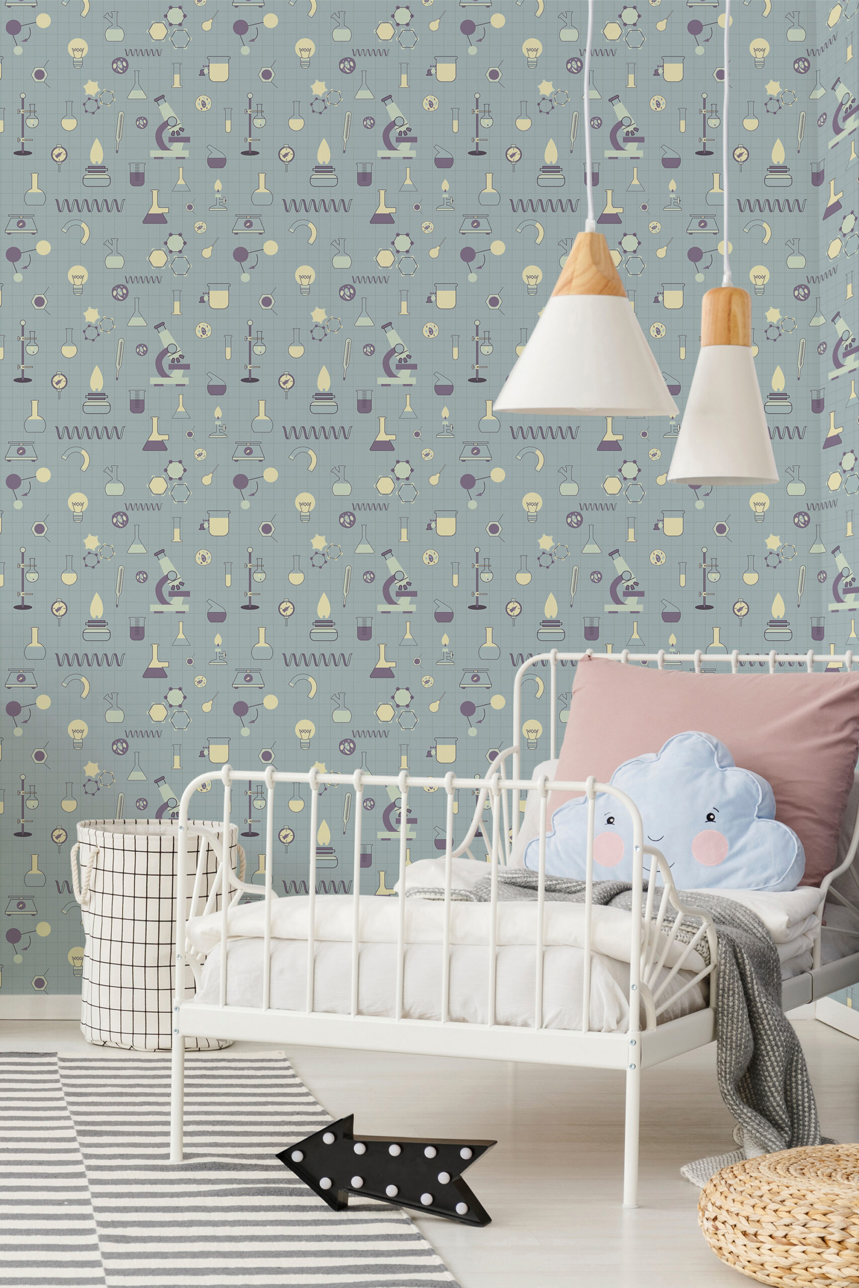 Playful Teal Science Icons pre-pasted wallpaper with lab tools and microscopes covers the wall behind a white crib.