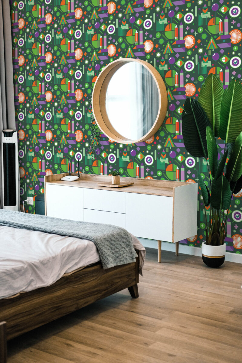 Green Geometric School Element peel and stick wallpaper with colorful retro shapes creates an accent wall behind a round mirror.