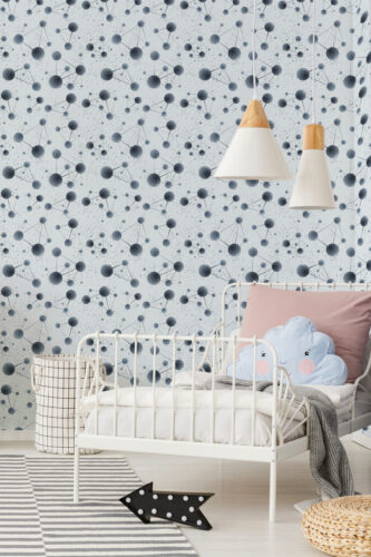Fine Blue Network Orbs peel and stick wallpaper with connected blue-gray circles behind a child’s bed on an accent wall.