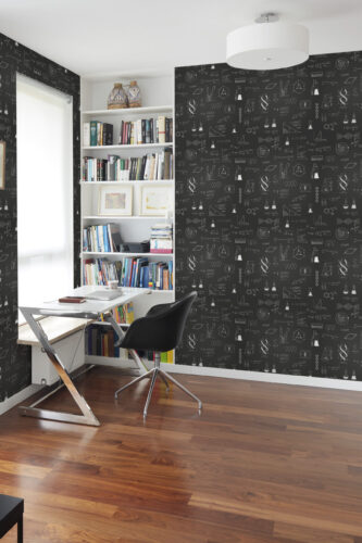 Scientific Chalkboard Black Line Art peel and stick wallpaper covers an office wall with white science sketches on black.