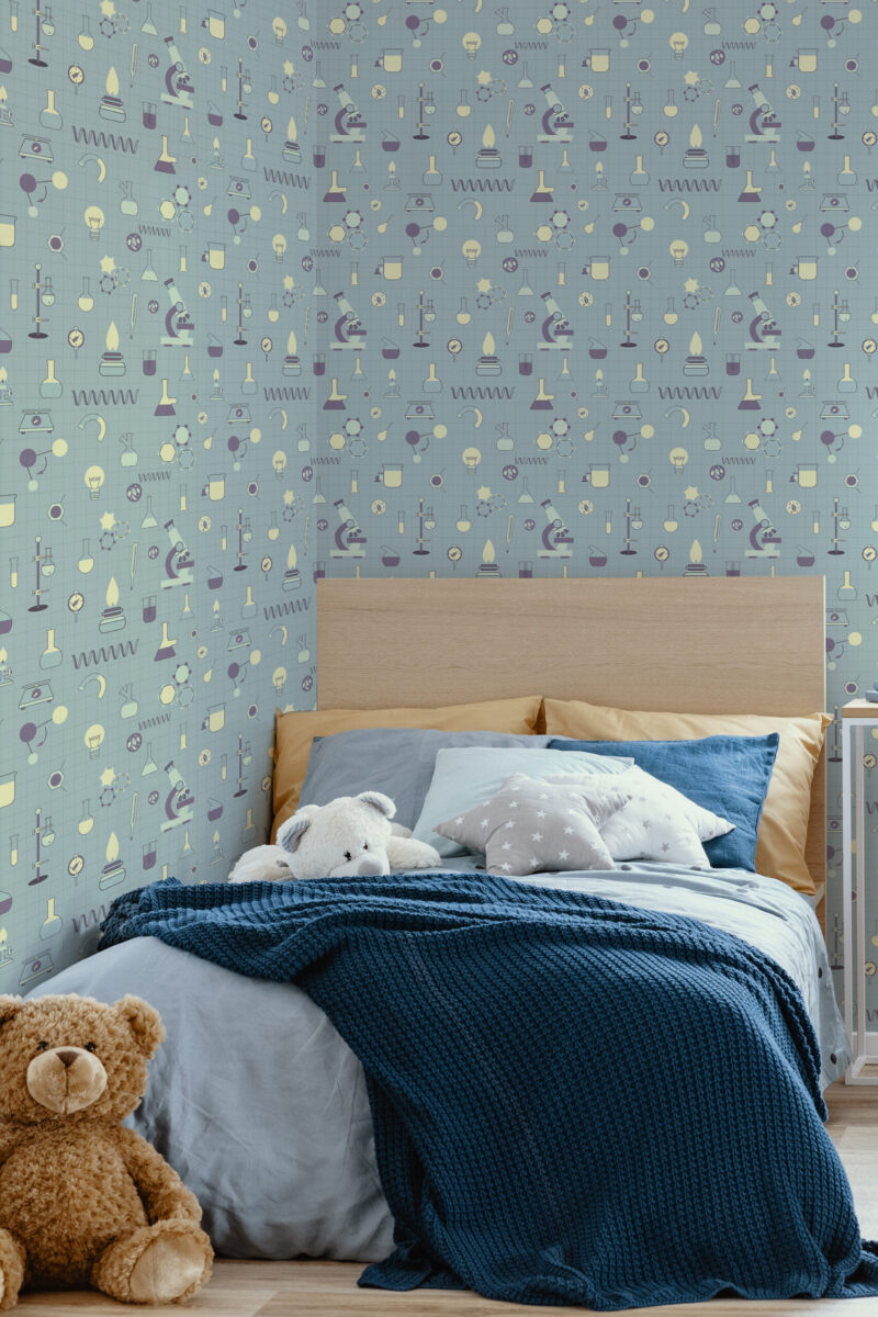 Playful Teal Science Icons peel and stick wallpaper with microscopes, beakers, and bulbs covering the wall behind the bed.