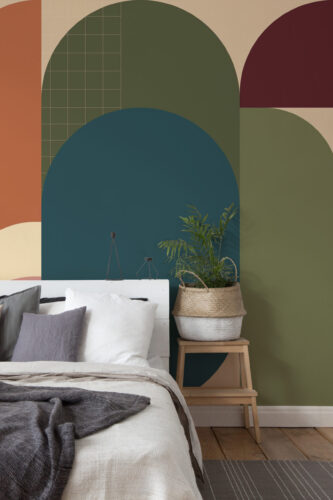 Retro Geometric Arches peel and stick wall mural with layered arches in teal, olive, terracotta, and burgundy behind a bed.