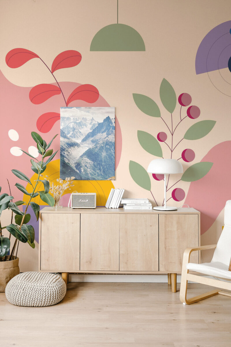 Abstract Botanical Sprigs self-adhesive wall mural with oversized leafy sprigs and soft pastel shapes behind a wooden sideboard.