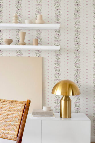 Whimsical Ivory Dragonfly non-pasted wallpaper with vertical dragonfly vines and tiny pink hearts behind a shelf and lamp.