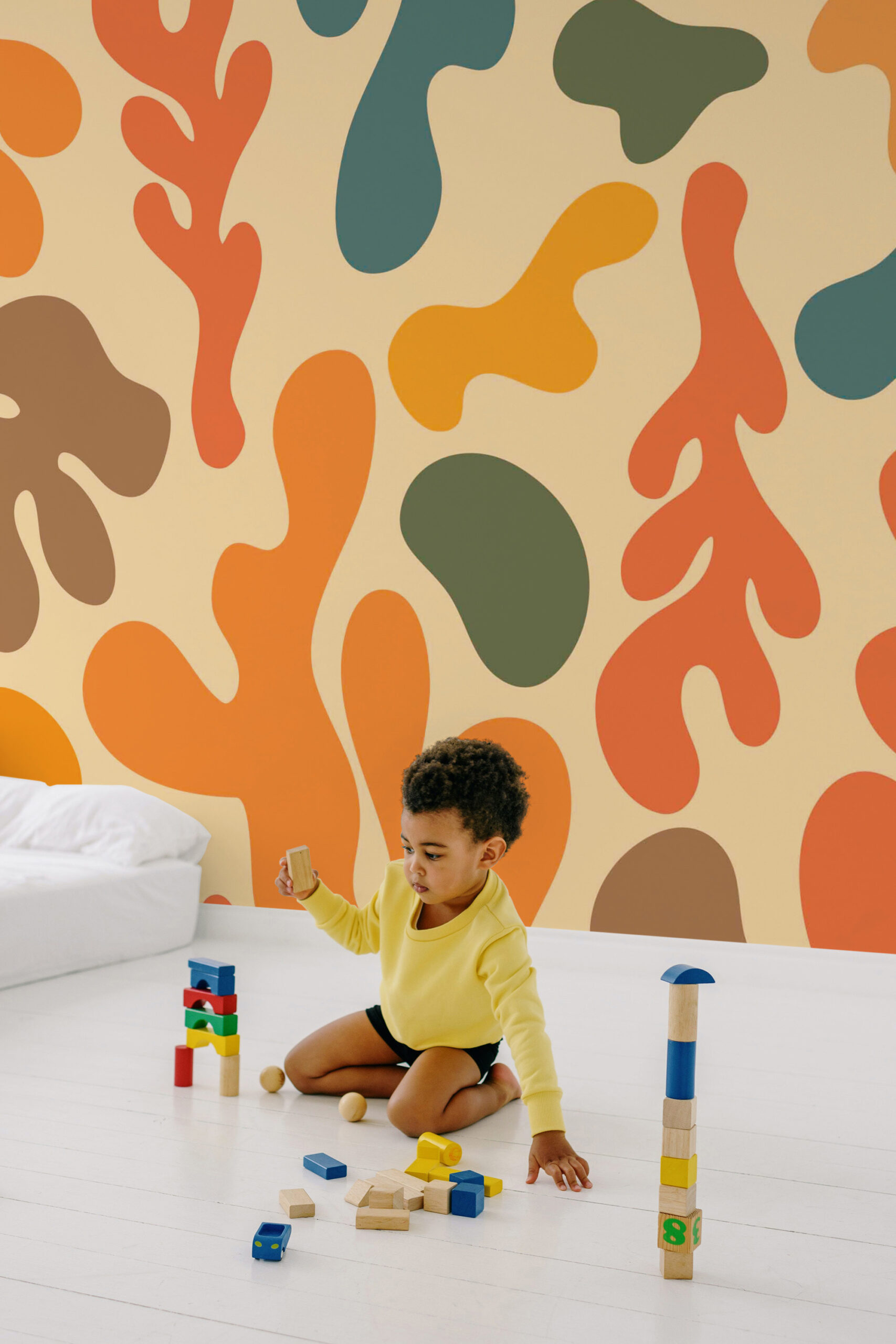 Retro Abstract Color Splash shows a traditional wall mural of bold, organic shapes in orange, teal, olive, and brown across a full wall.