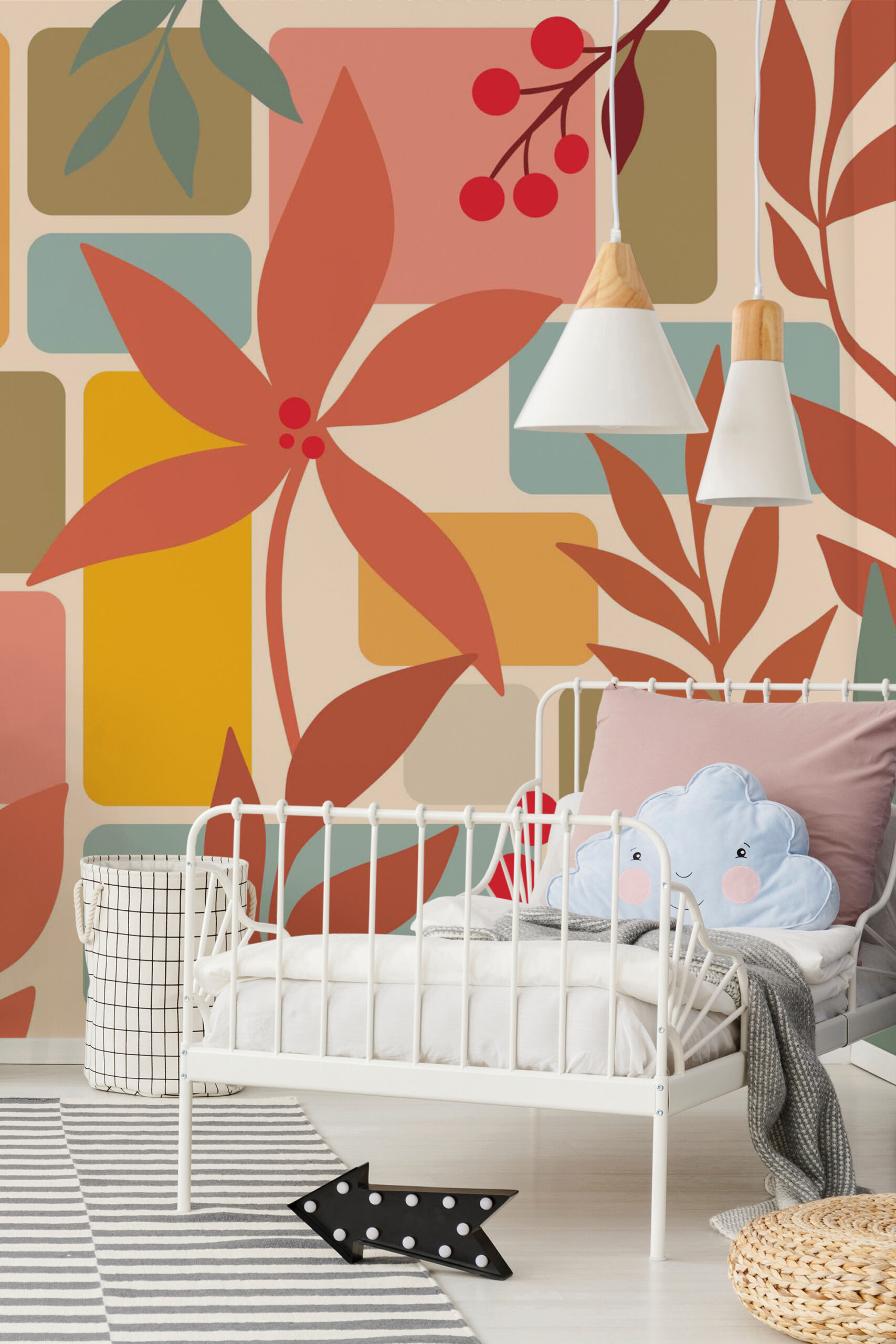 Retro Botanical Leaf Collage removable wall mural with oversized coral leaves and geometric blocks covering the wall behind a child’s bed.