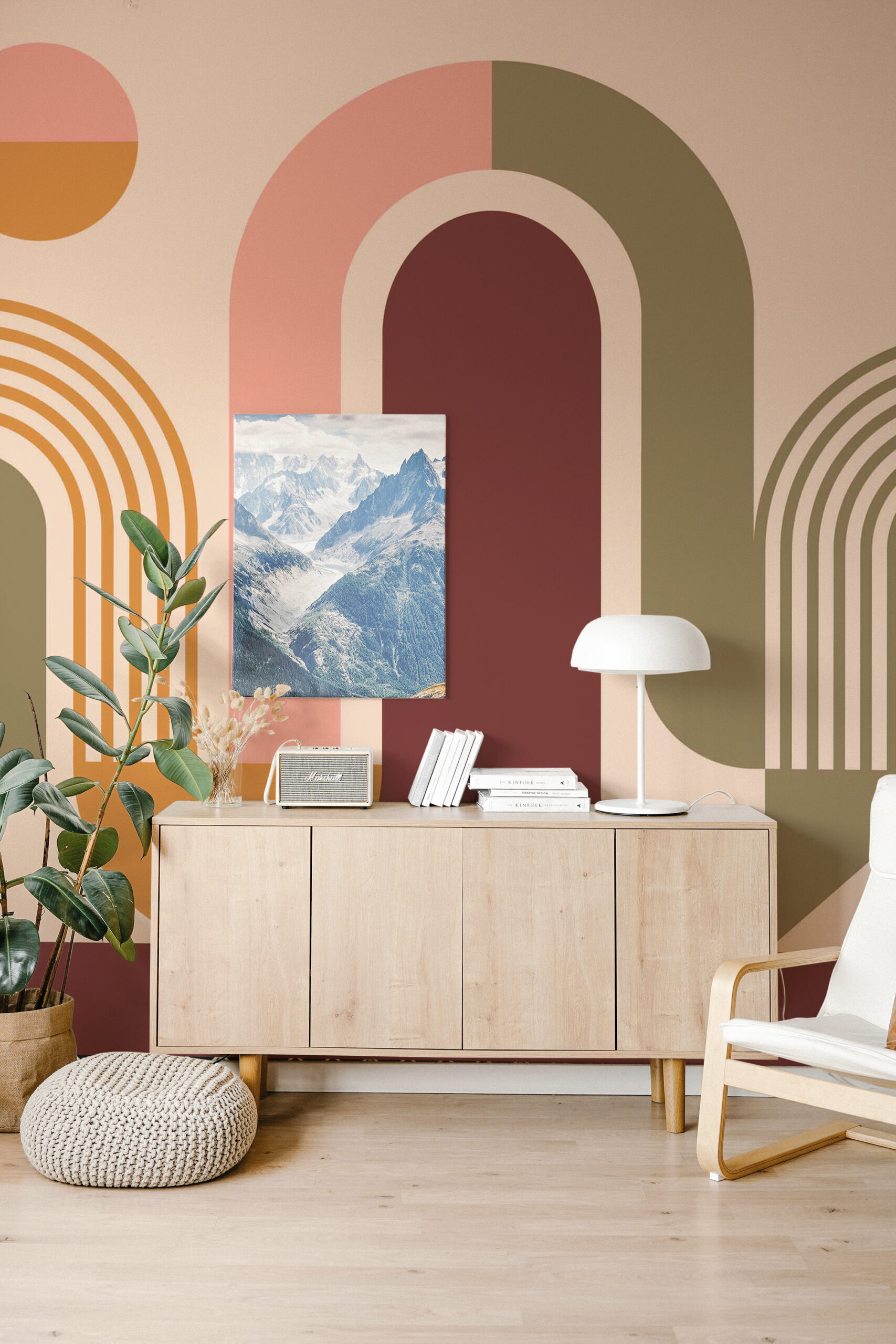 Retro Arches and Circles non-pasted wall mural with large layered arches and circles in blush, orange, olive, and burgundy behind a sideboard.