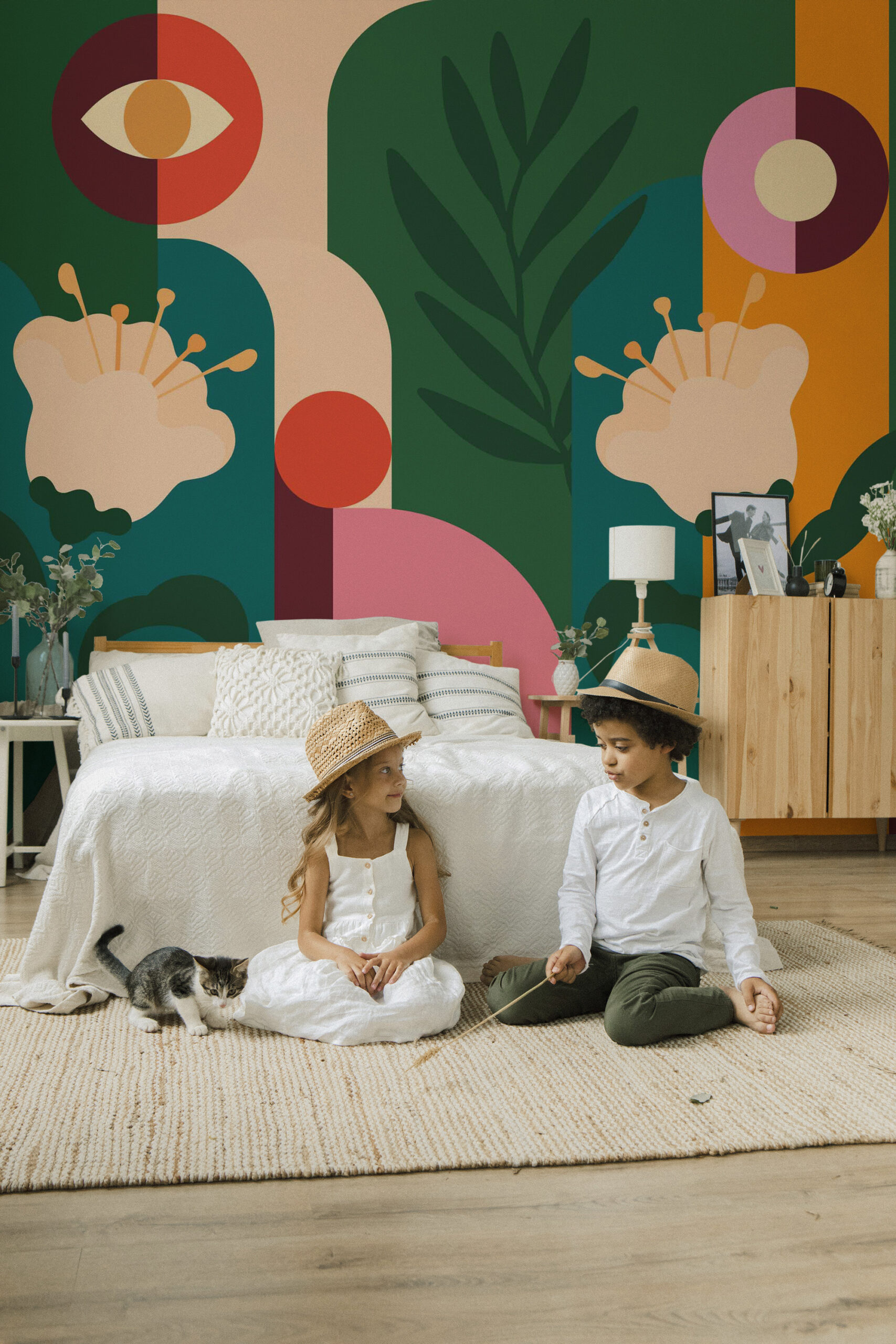 Retro Floral Garden self-adhesive wall mural covering a bedroom accent wall with bold abstract flowers, arches, and leafy shapes in green and pink.