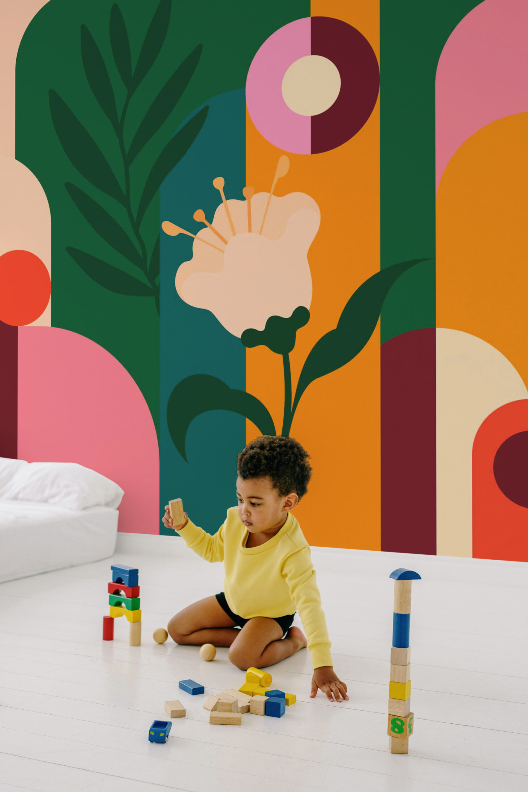 Retro Floral Garden non-pasted wall mural with bold geometric arches and a stylized flower covering a full accent wall.