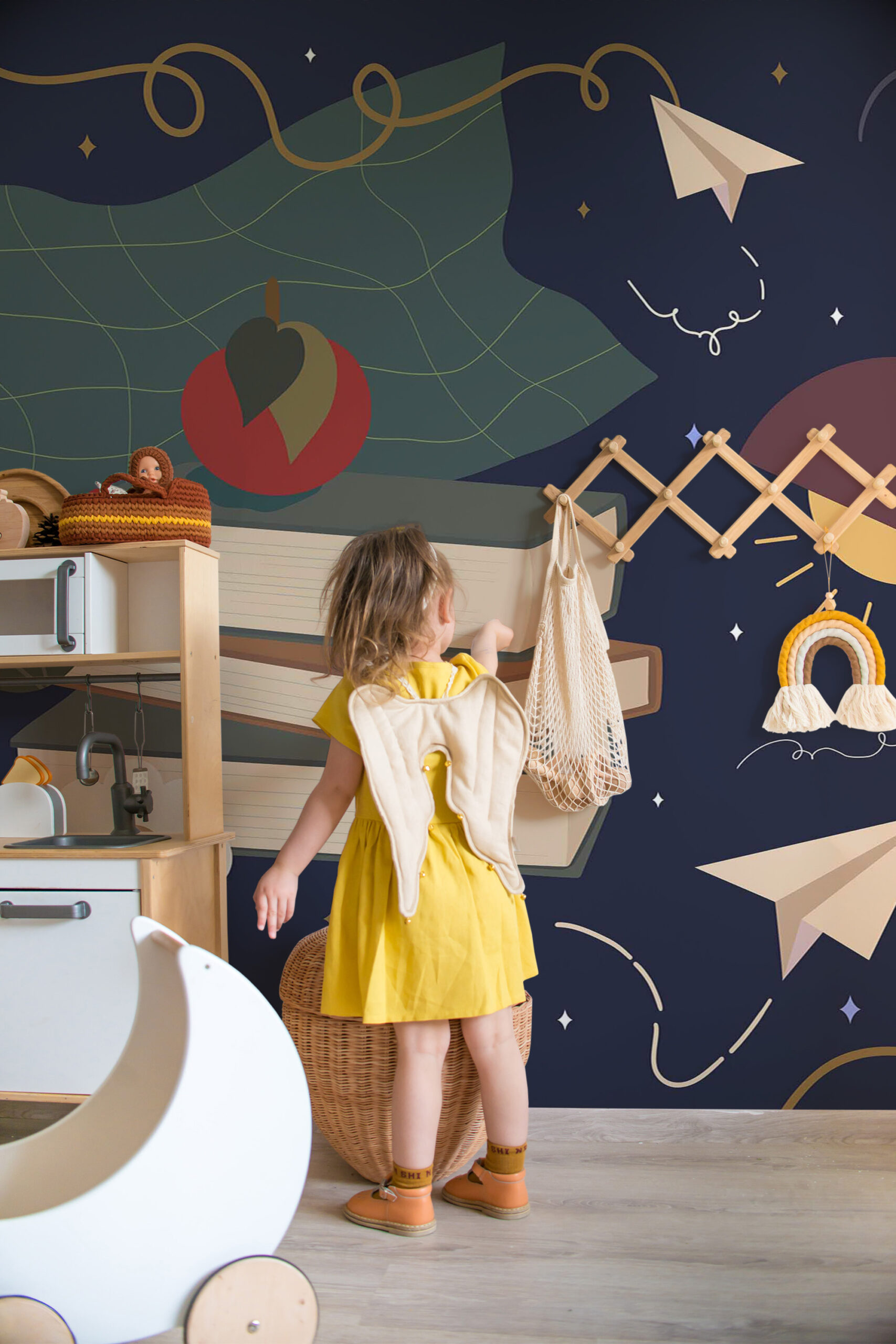 Whimsical Study Desk non-pasted wall mural with paper airplanes, stars, and an abstract map pattern covering a kids' playroom wall.