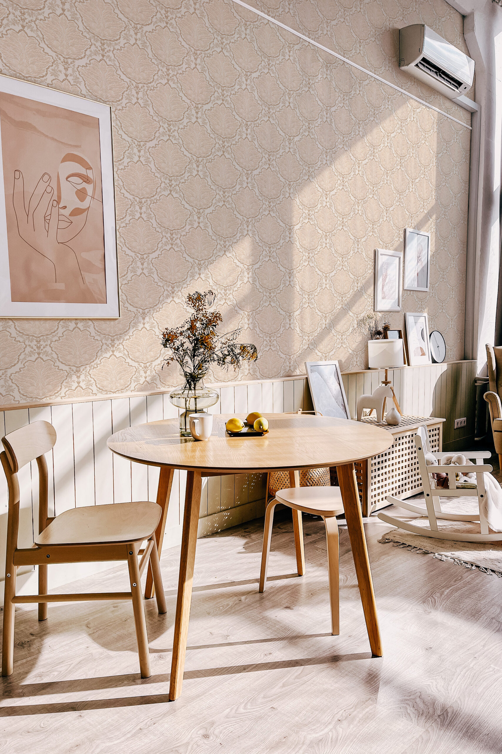 Vintage Ivory Leaf Damask self-adhesive wallpaper covers the dining room wall with an ivory damask leaf pattern.