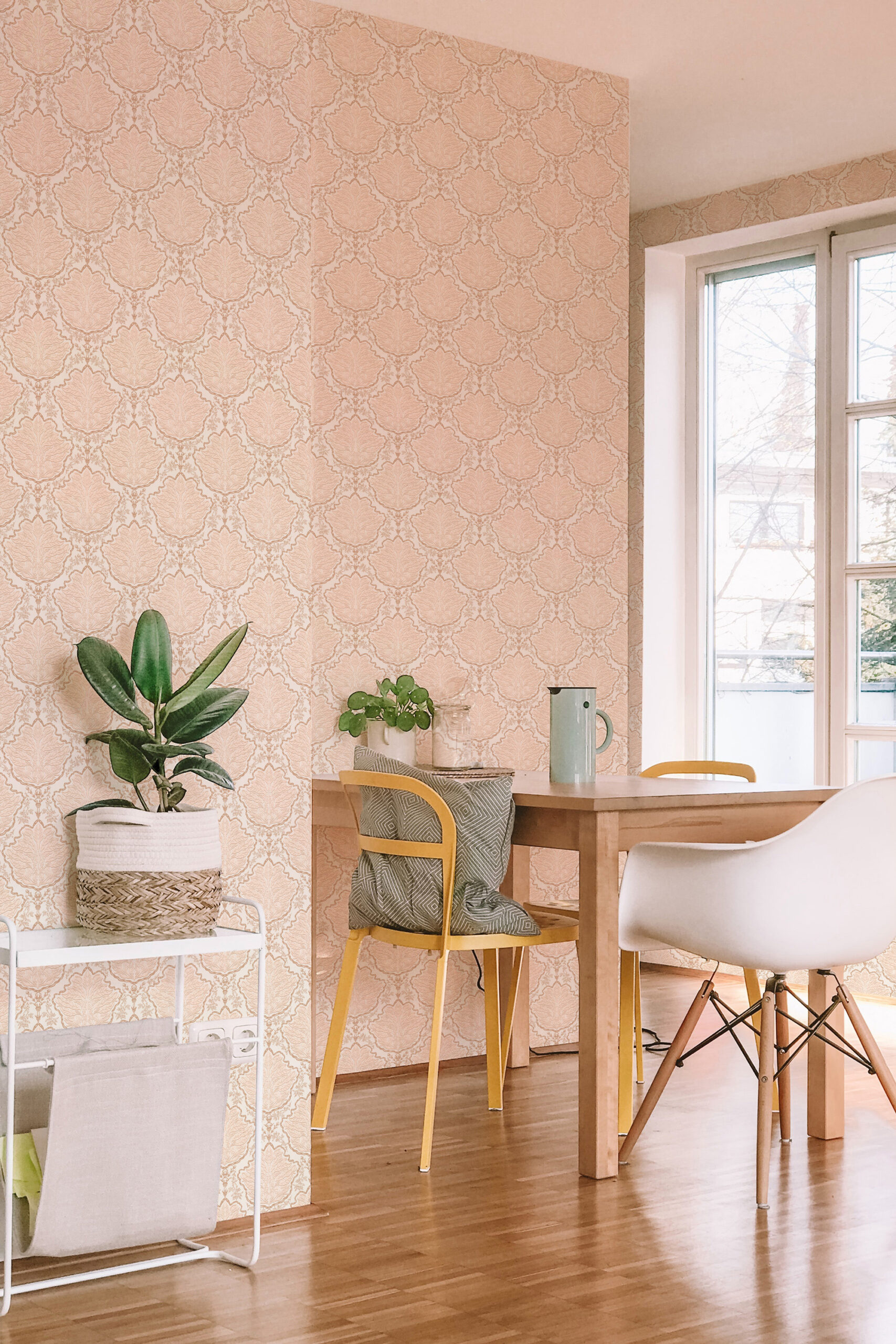 Vintage Ivory Leaf Damask pre-pasted wallpaper covers a dining nook wall with a delicate ivory damask leaf pattern.