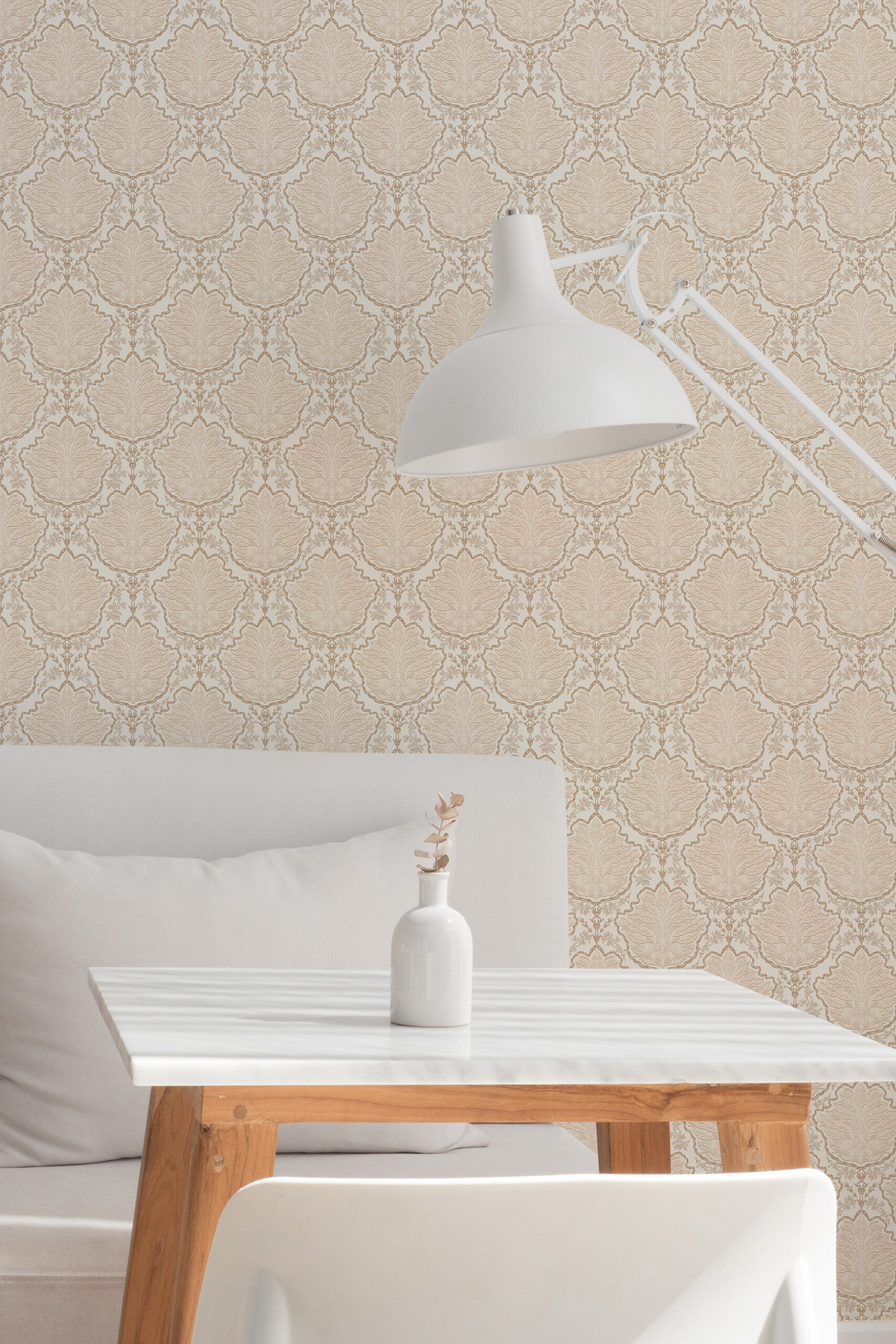 Vintage Ivory Leaf Damask non-pasted wallpaper with a repeating leaf damask pattern behind a white desk lamp.