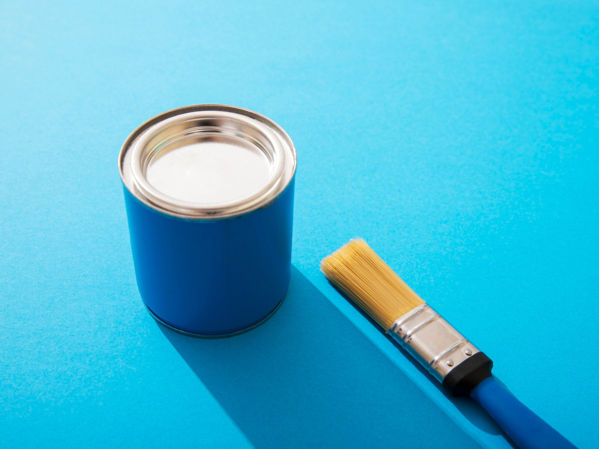 blue wall paint and brush
